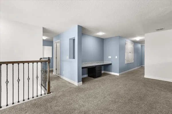 a bathroom that has a glass shower door