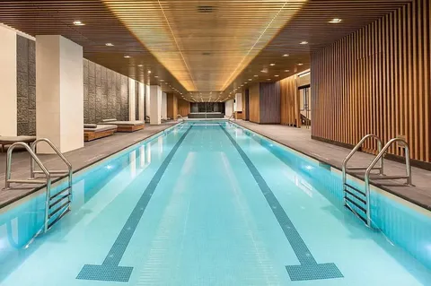 a view of a swimming pool with a balcony