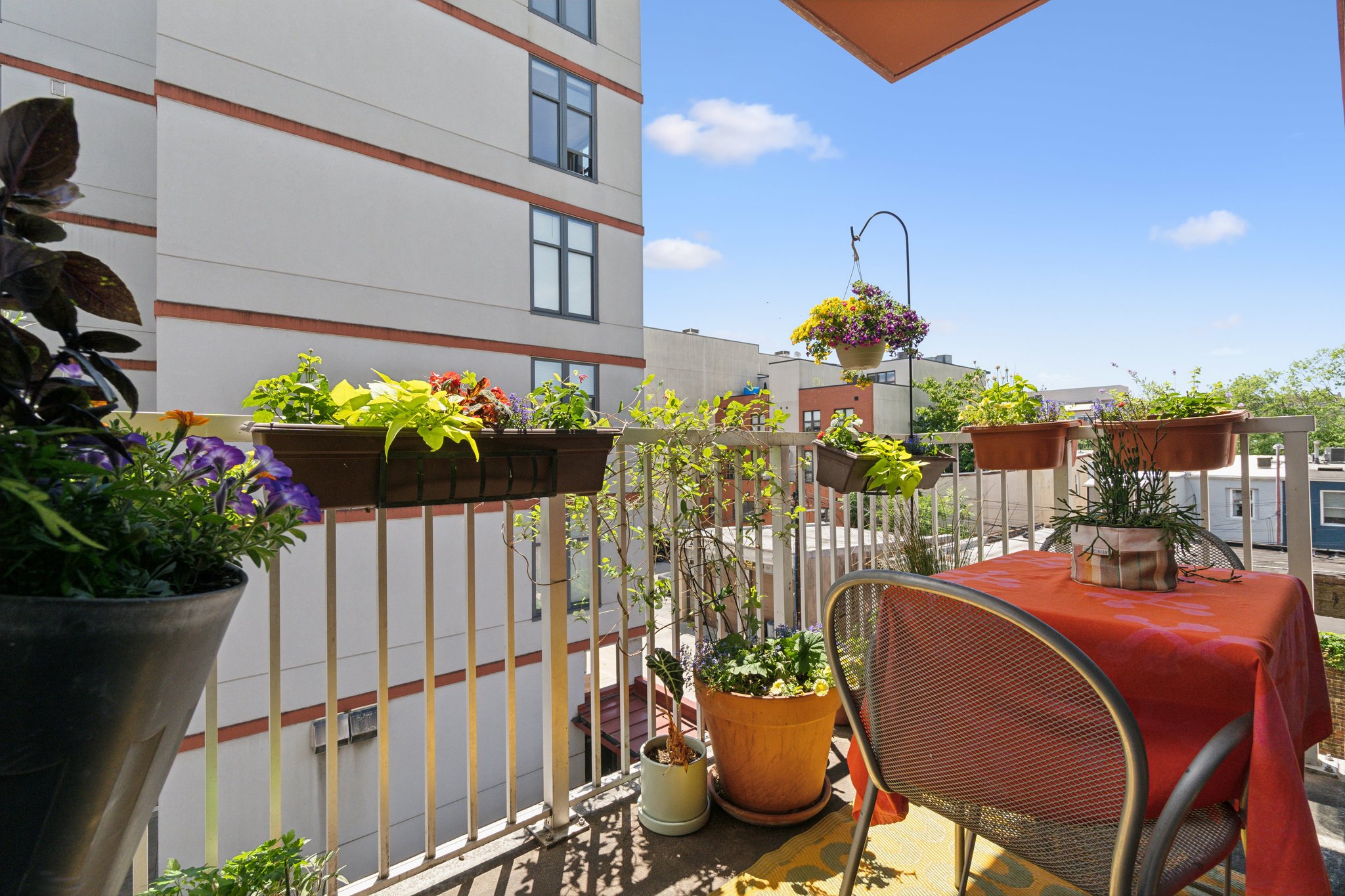 2120 Vermont Avenue Northwest, Unit 309 Washington, DC 20001 - Photo 21 of 26 a front view of a house with wooden chairs in patio