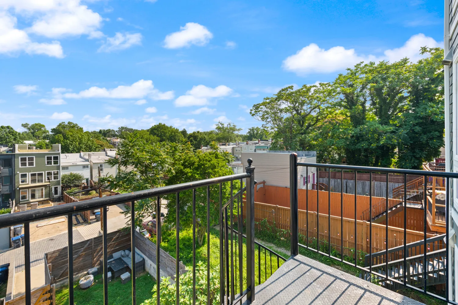 a view of balcony with wooden floor and fence