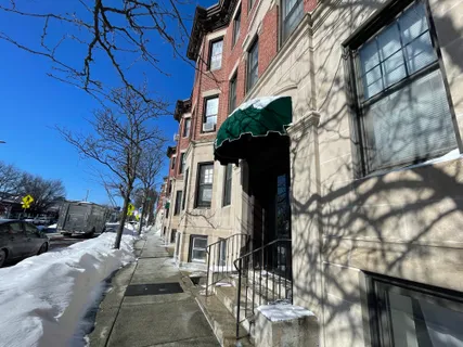 a view of multiple houses with a yard