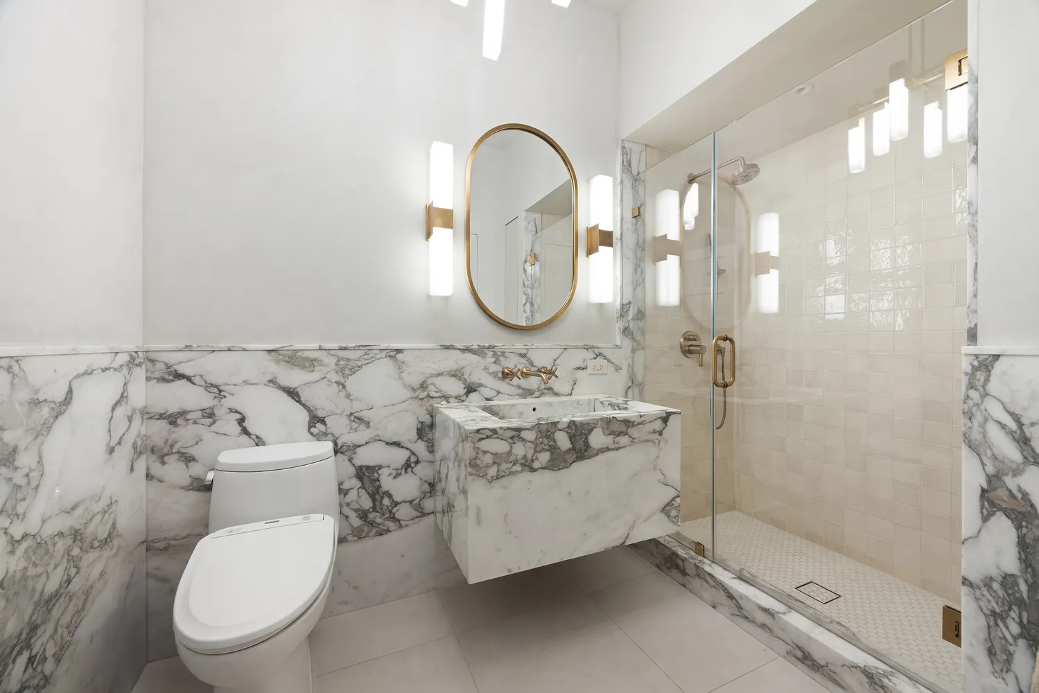 a bathroom with a toilet sink and shower