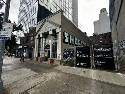 a view of a street with an outdoor space