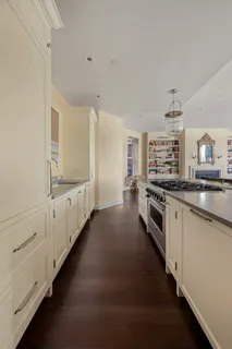a kitchen with stainless steel appliances a white stove top oven and a refrigerator