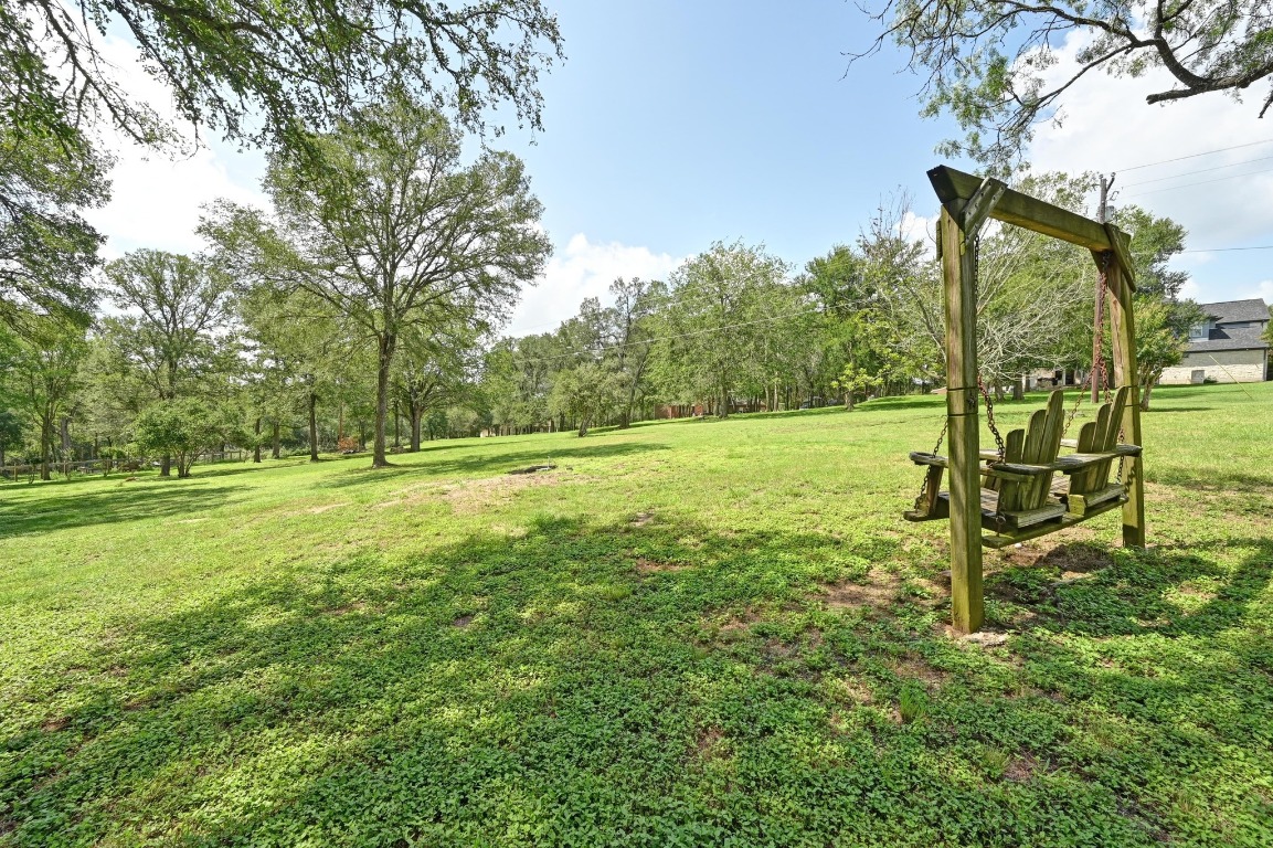 111 Trinity Street Cedar Creek, TX 78612 - Photo 31 of 38 a view of outdoor space with deck and yard
