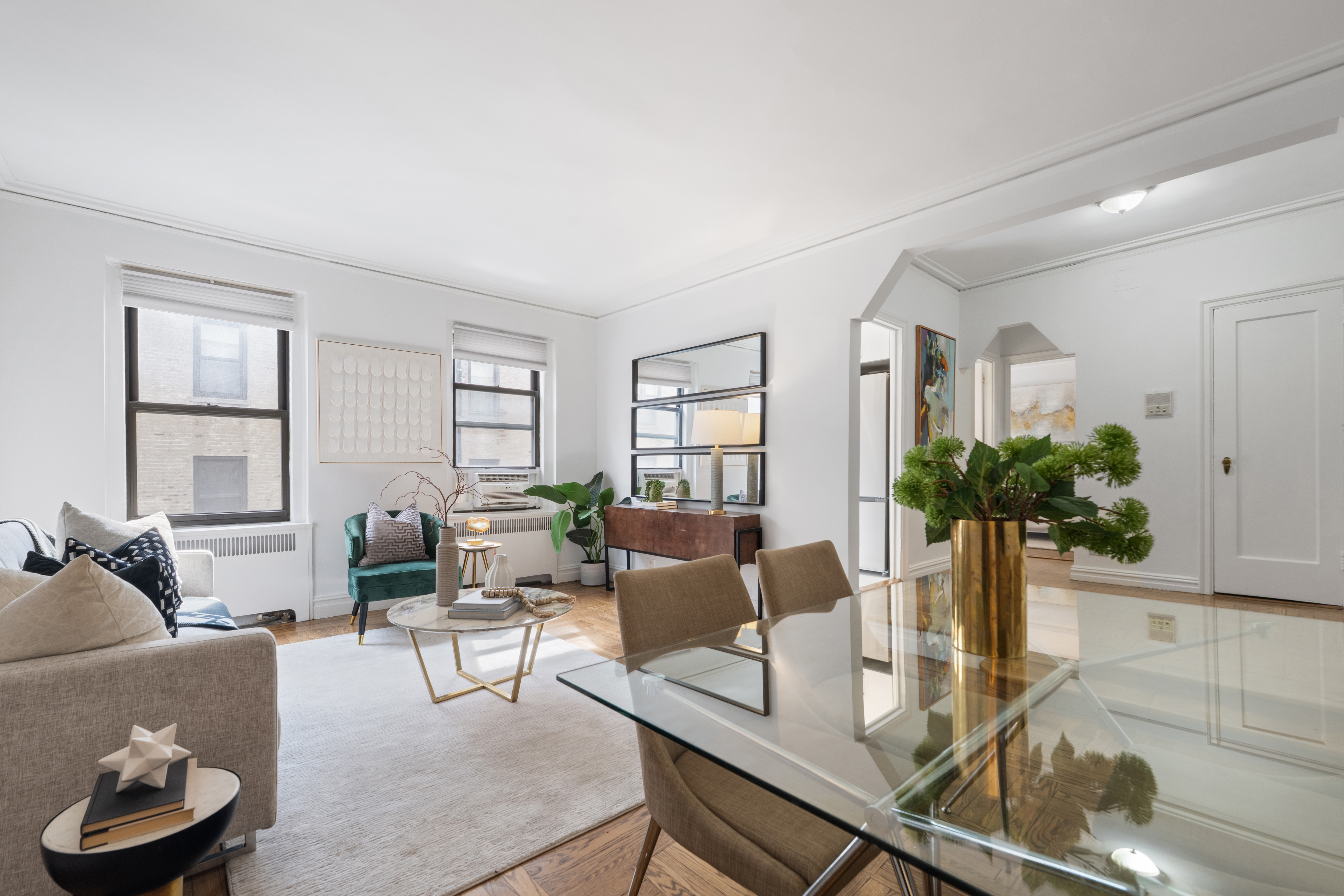 350 Cabrini Boulevard, Unit 7N Manhattan, NY 10040 - Photo 2 of 10 a living room with furniture and a potted plant
