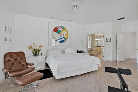 a bathroom with a tub and a window