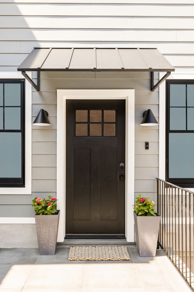 578 20th Street Brooklyn, NY 11218 - Photo 23 of 24 a view of a white house with potted plants