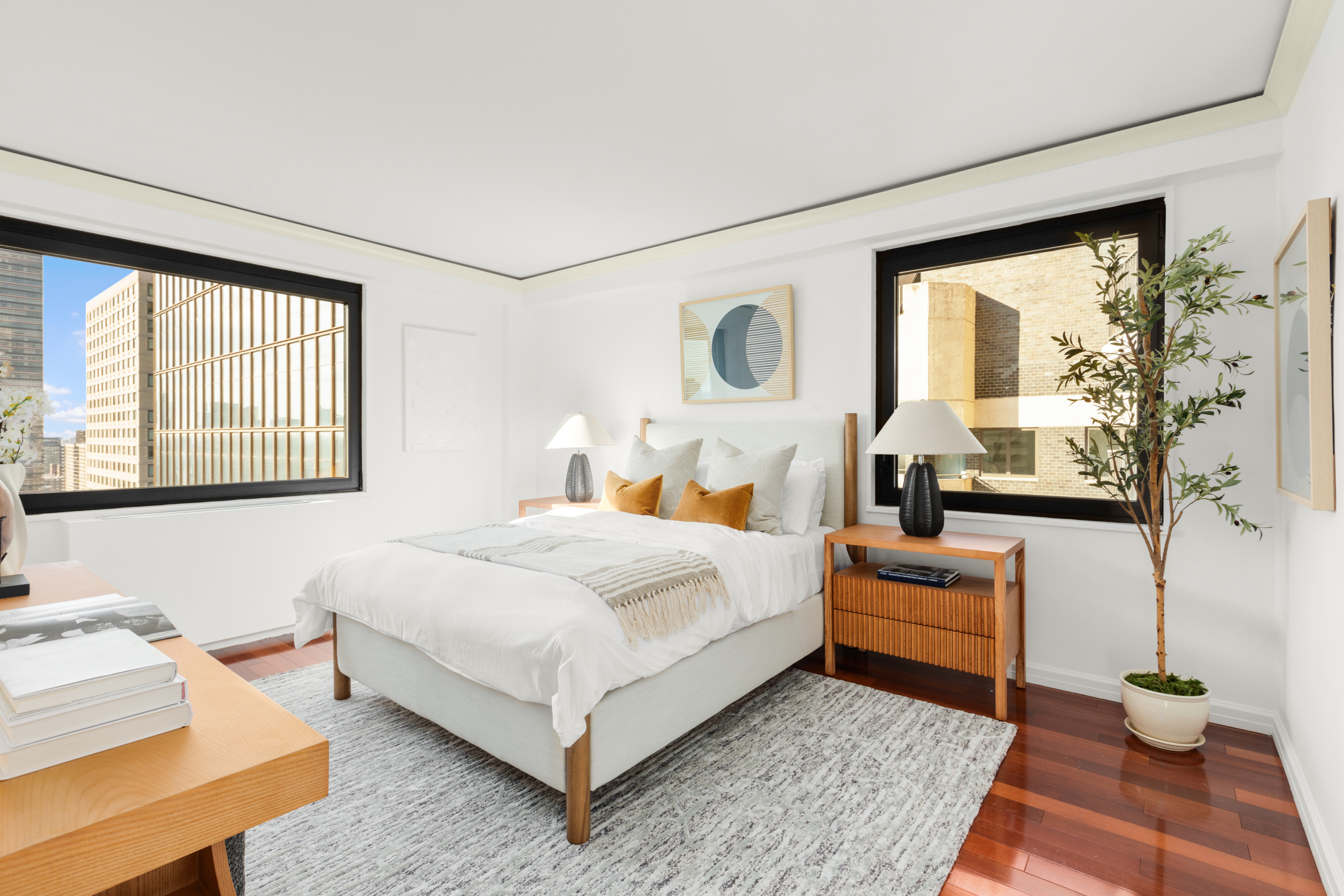 10 West 66th Street, Unit 29E Manhattan, NY 10023 - Photo 11 of 39 a bedroom with a large bed and a window