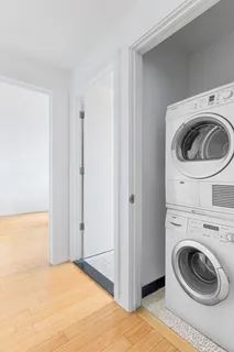 a view of a bedroom with washing machine