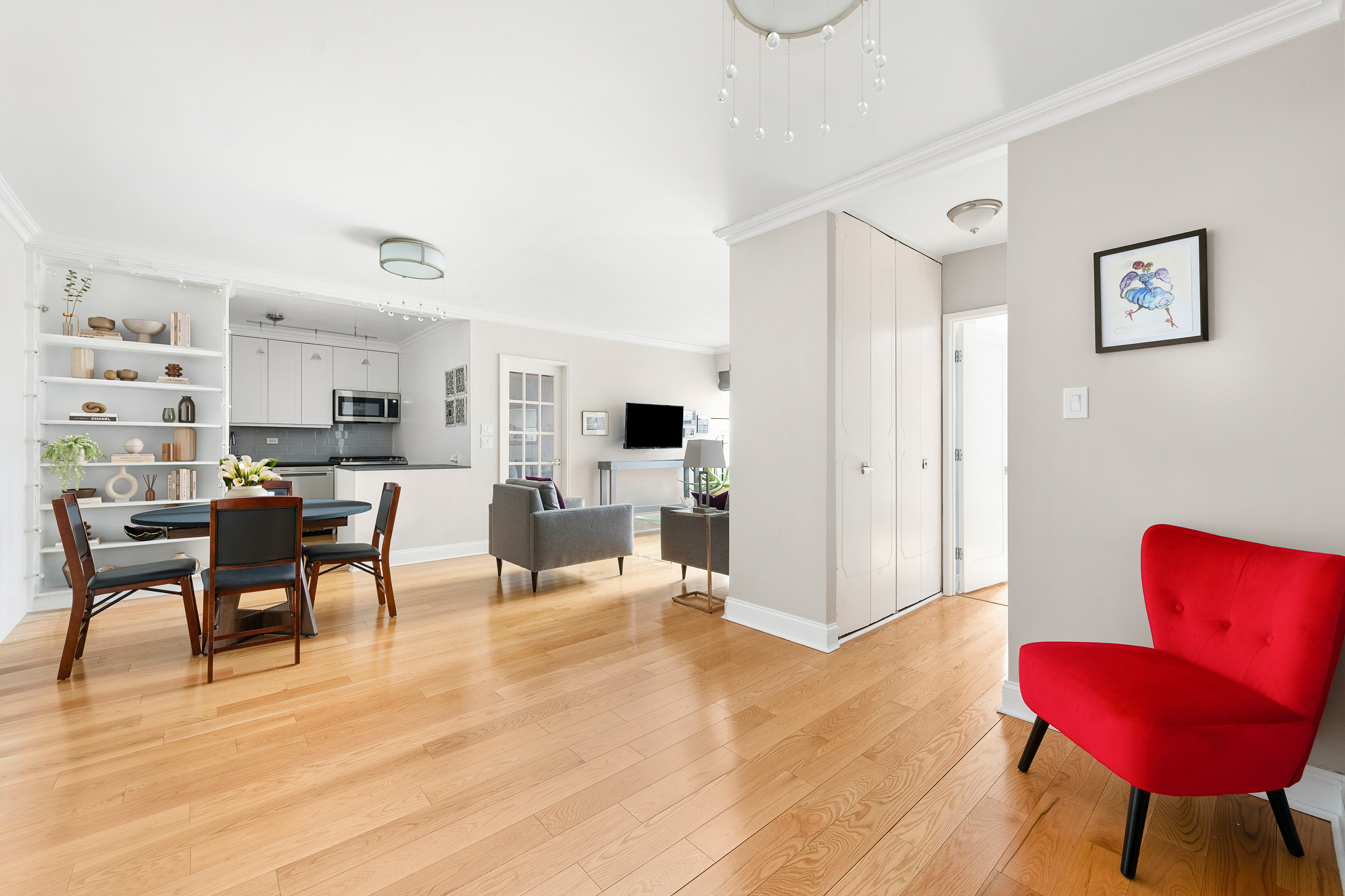 400 East 56th Street, Unit 19O Manhattan, NY 10022 - Photo 4 of 20 a living room with furniture and a wooden floor