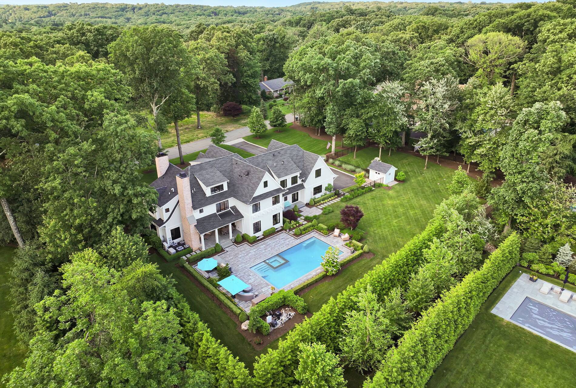 838 Seneca Road Franklin Lakes, NJ 07417 - Photo 87 of 92 an aerial view of a house with a garden and swimming pool