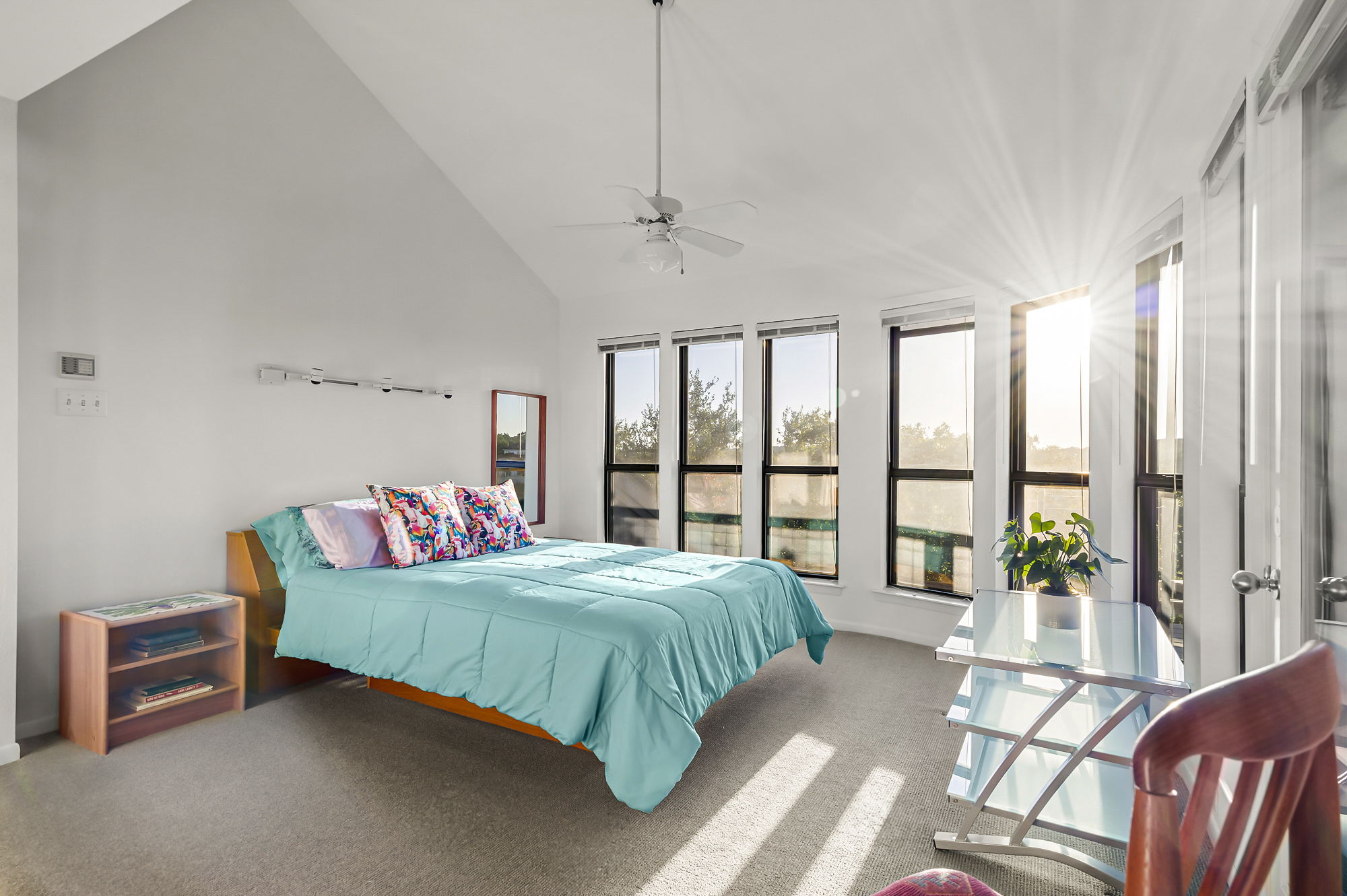 1605 The High Road Austin, TX 78746 - Photo 24 of 45 a bedroom with a bed and a large window