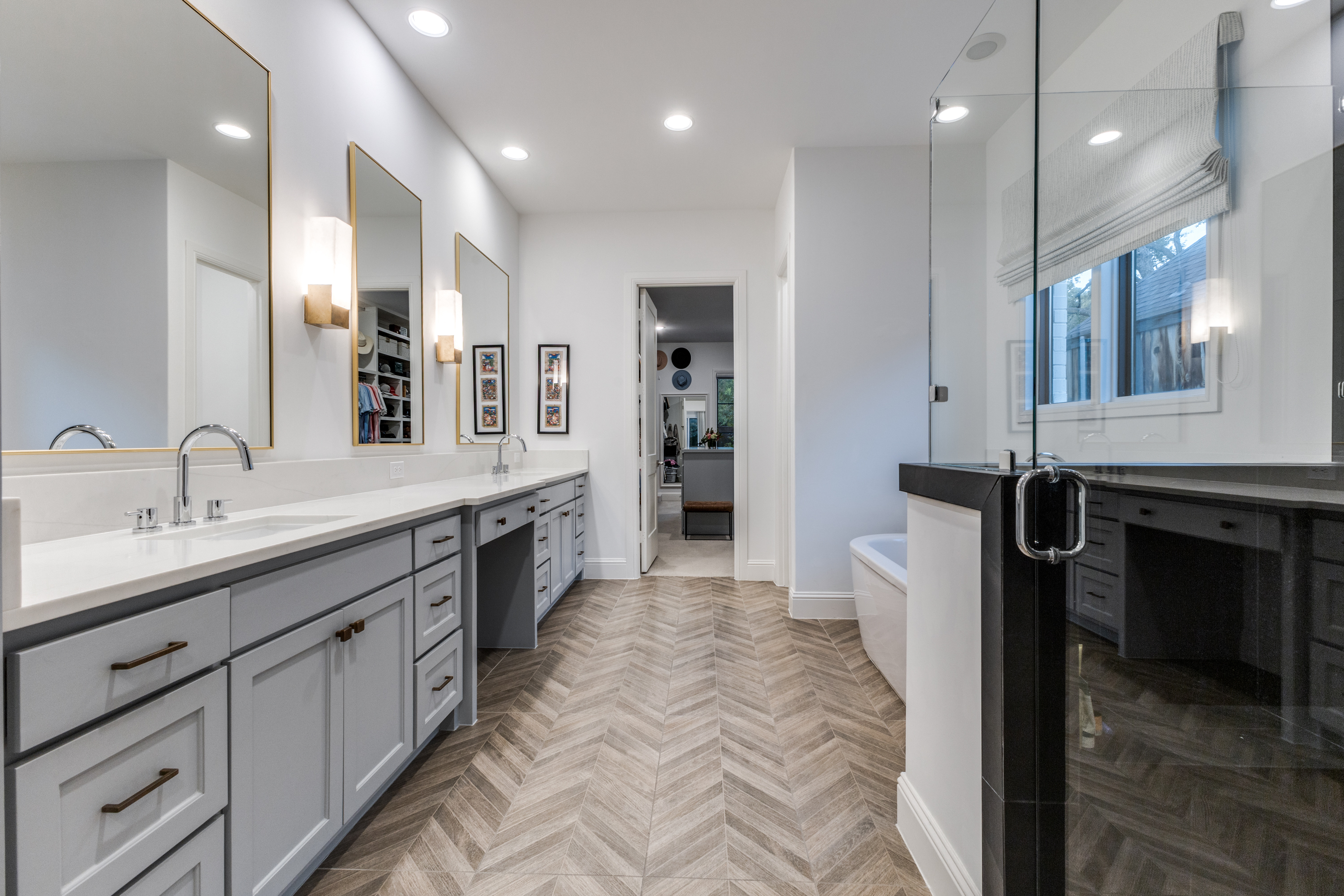 4042 Dunhaven Road Dallas, TX 75220 - Photo 20 of 34 a spacious bathroom with a double vanity sink a mirror and a shower