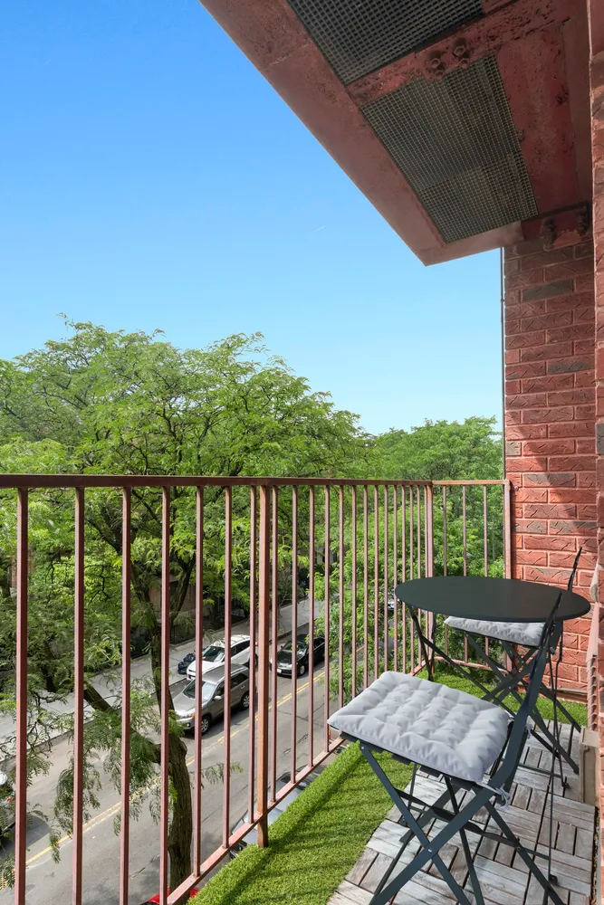 a view of a chairs and table in patio