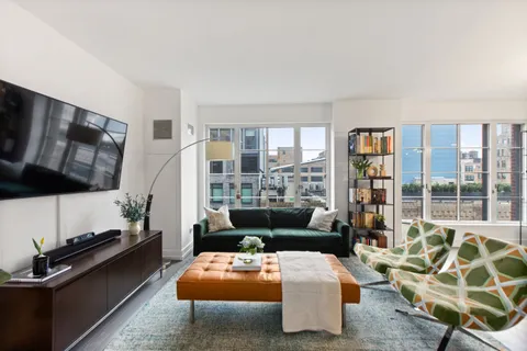 a living room with furniture fireplace and a flat screen tv