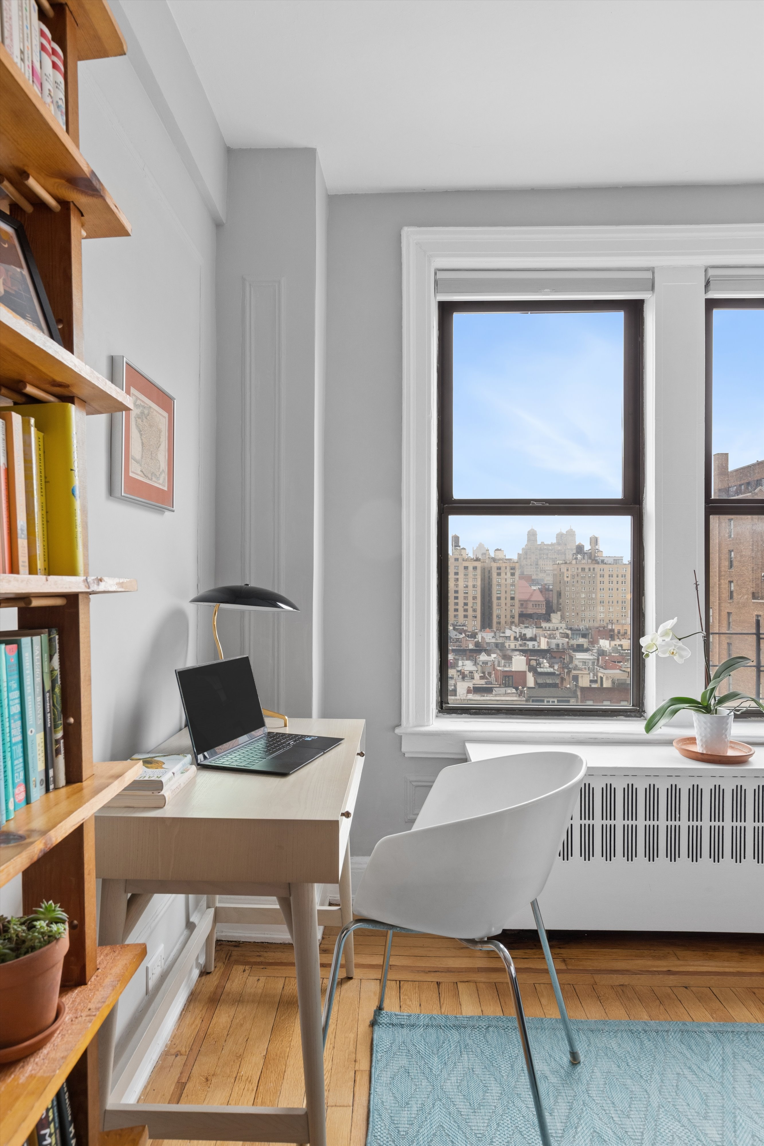 41 West 72nd Street, Unit 15E Manhattan, NY 10023 - Photo 8 of 12 a view of a workspace with furniture and a window