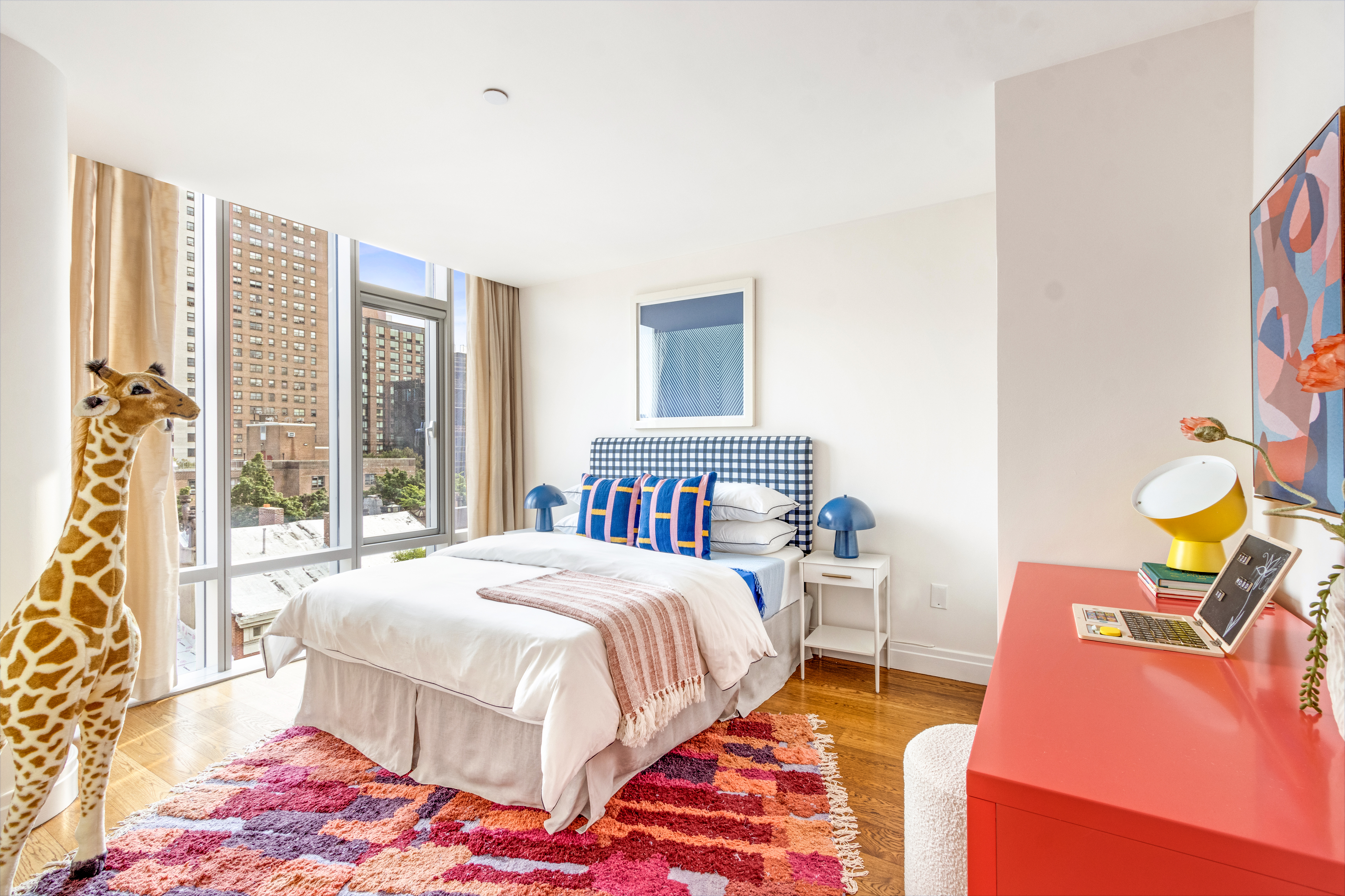 177 9th Avenue, Unit PHA Manhattan, NY 10011 - Photo 17 of 28 a bedroom with a bed and a window