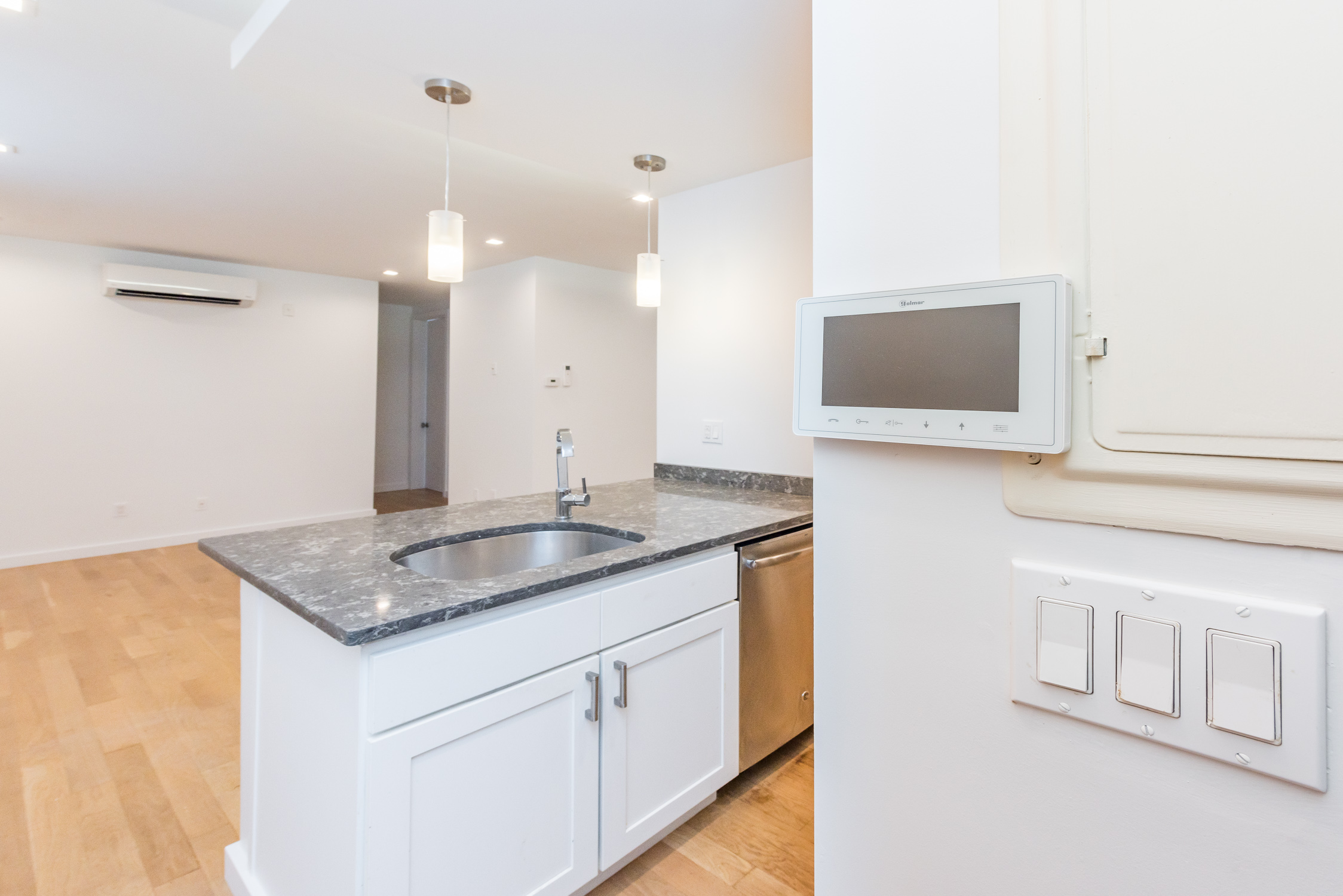 22-11 Steinway Street, Unit 3R Queens, NY 11105 - Photo 4 of 9 a bathroom with a granite countertop sink and a mirror