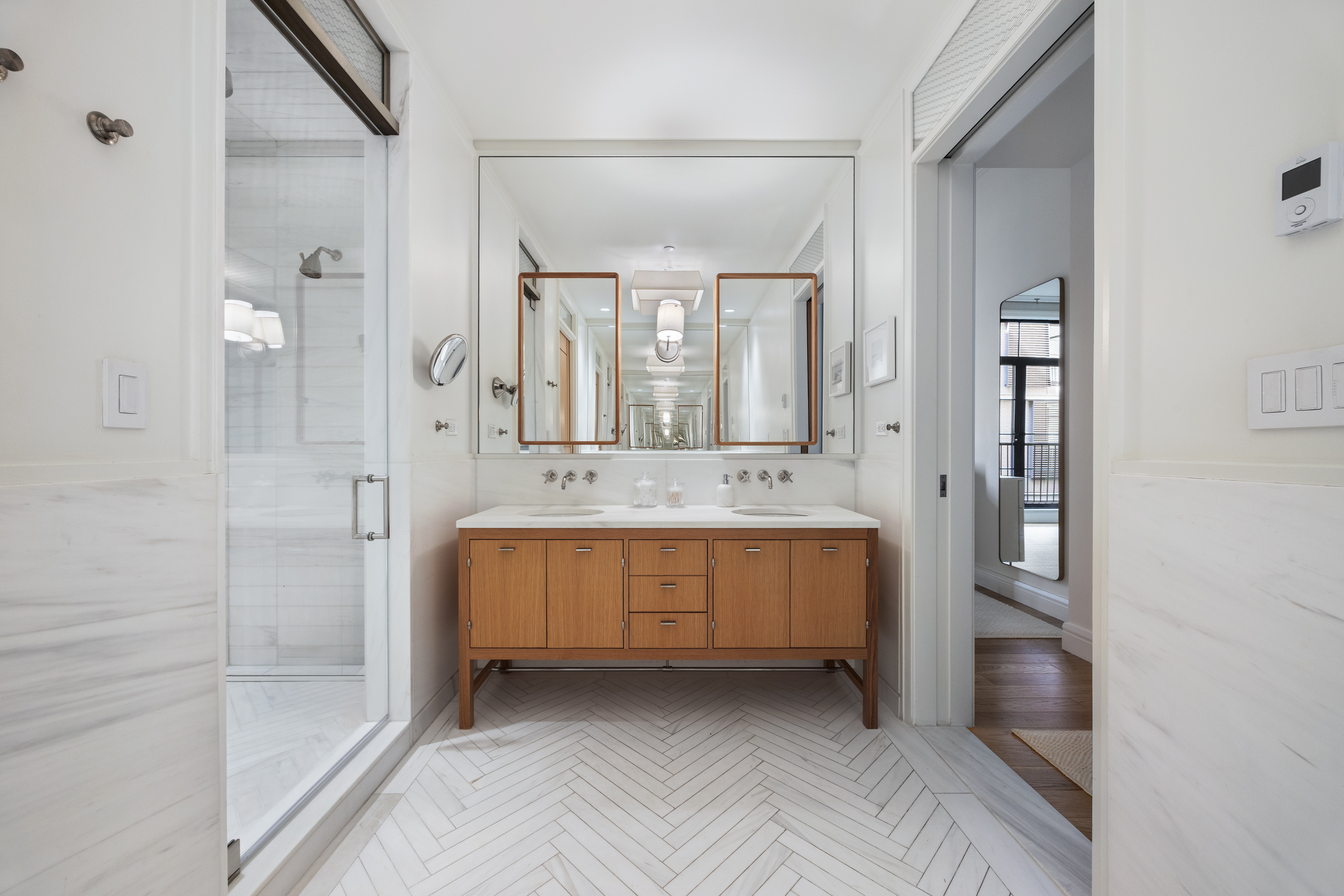 71 Laight Street, Unit 2F Manhattan, NY 10013 - Photo 8 of 20 a bathroom with a double vanity sink and mirror with shower
