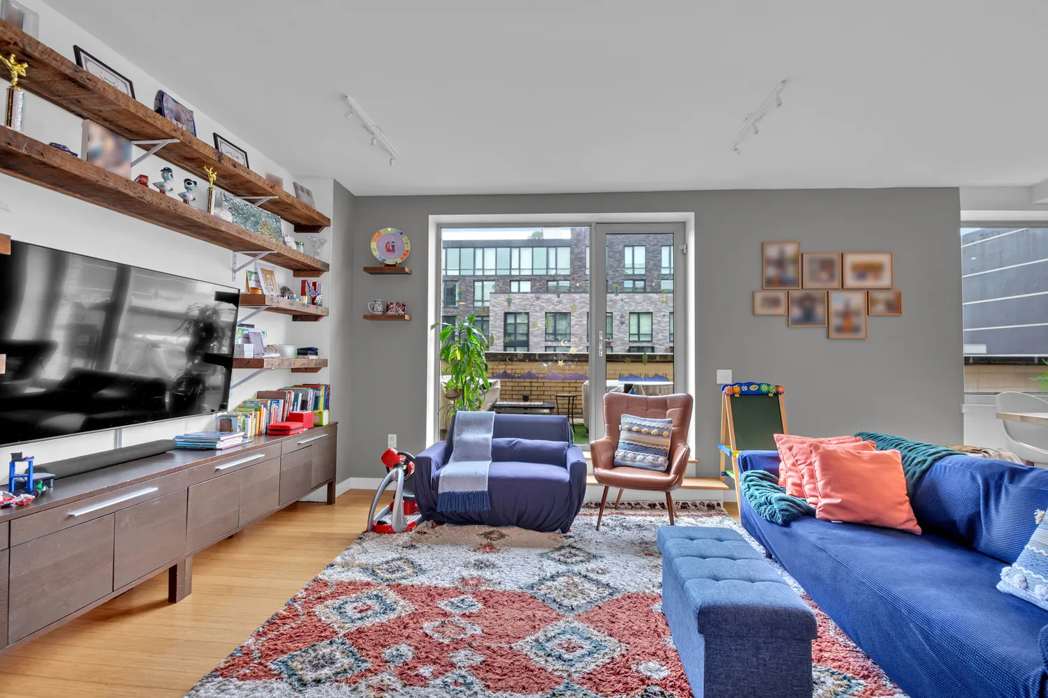 a living room with furniture and a flat screen tv