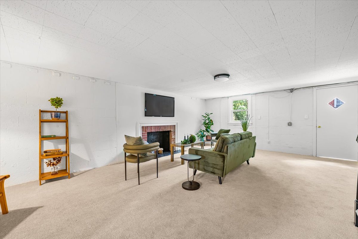 1902 Rookwood Road Silver Spring, MD 20910 - Photo 29 of 36 a living room with furniture and a flat screen tv