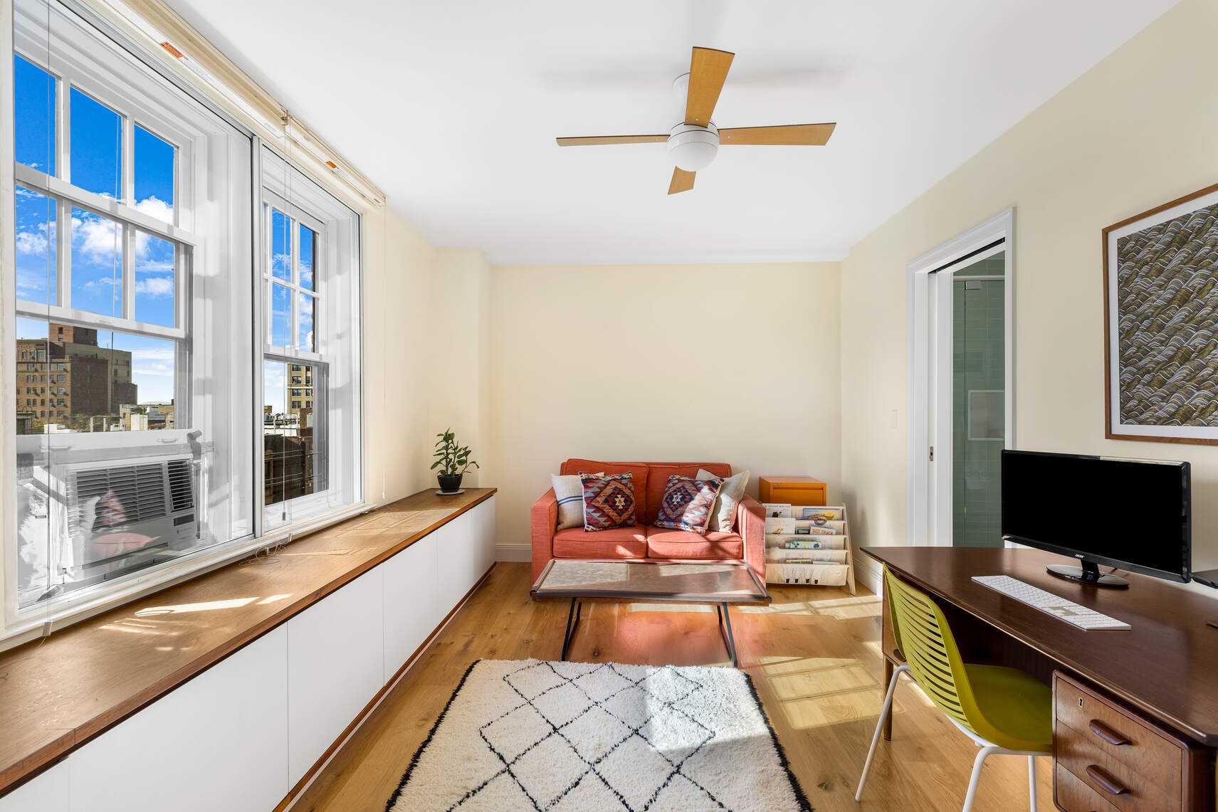 47 Plaza Street West, Unit 5B Brooklyn, NY 11217 - Photo 7 of 14 a reading room with furniture and a flat screen tv
