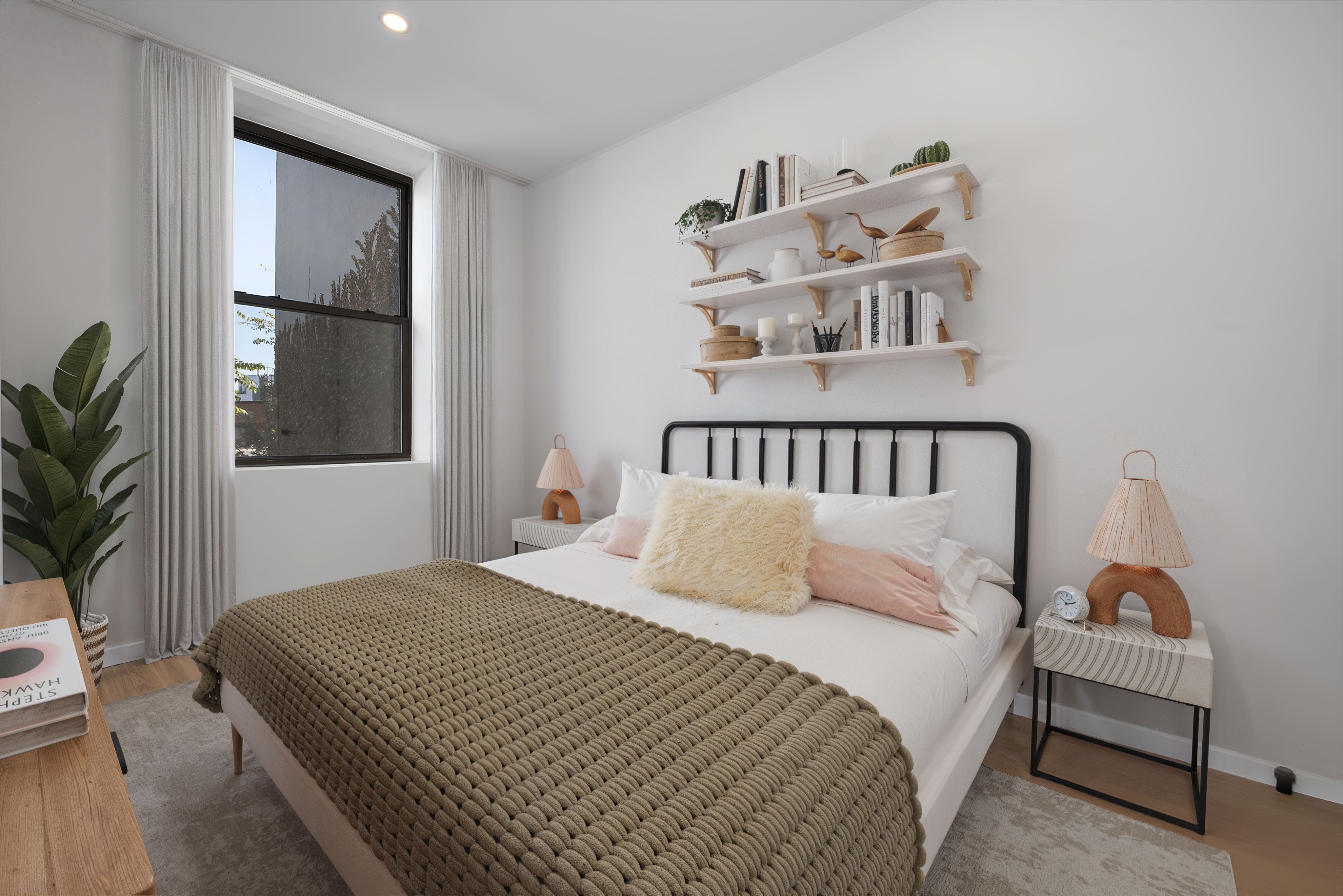 250 Union Avenue, Unit 3B Brooklyn, NY 11211 - Photo 4 of 7 a bedroom with a bed and wooden floor