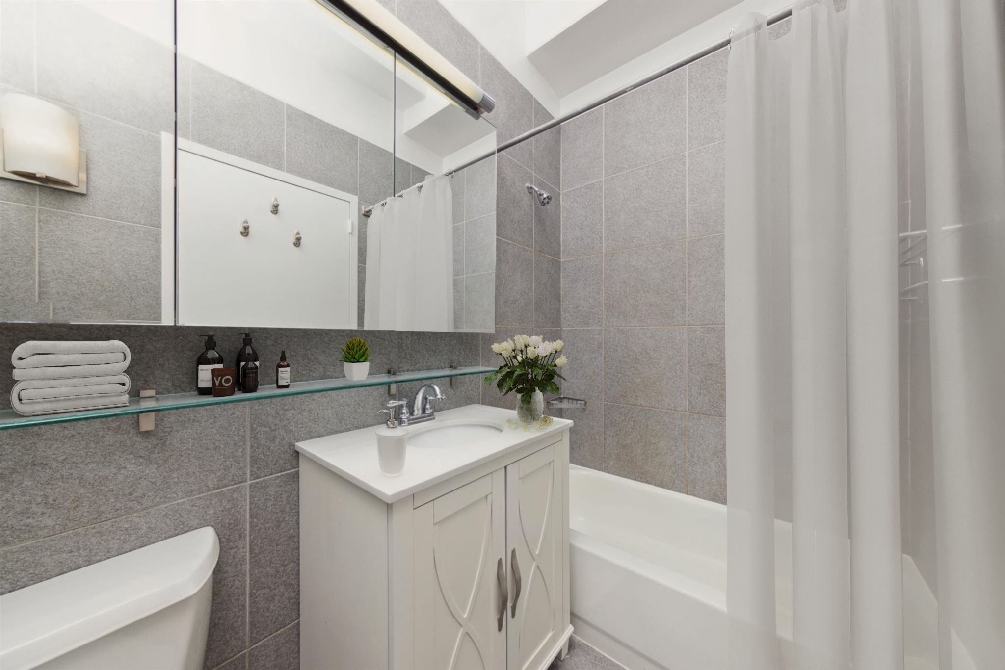 80 John Street, Unit 9C Manhattan, NY 10038 - Photo 8 of 10 a bathroom with a sink a toilet and a bathtub