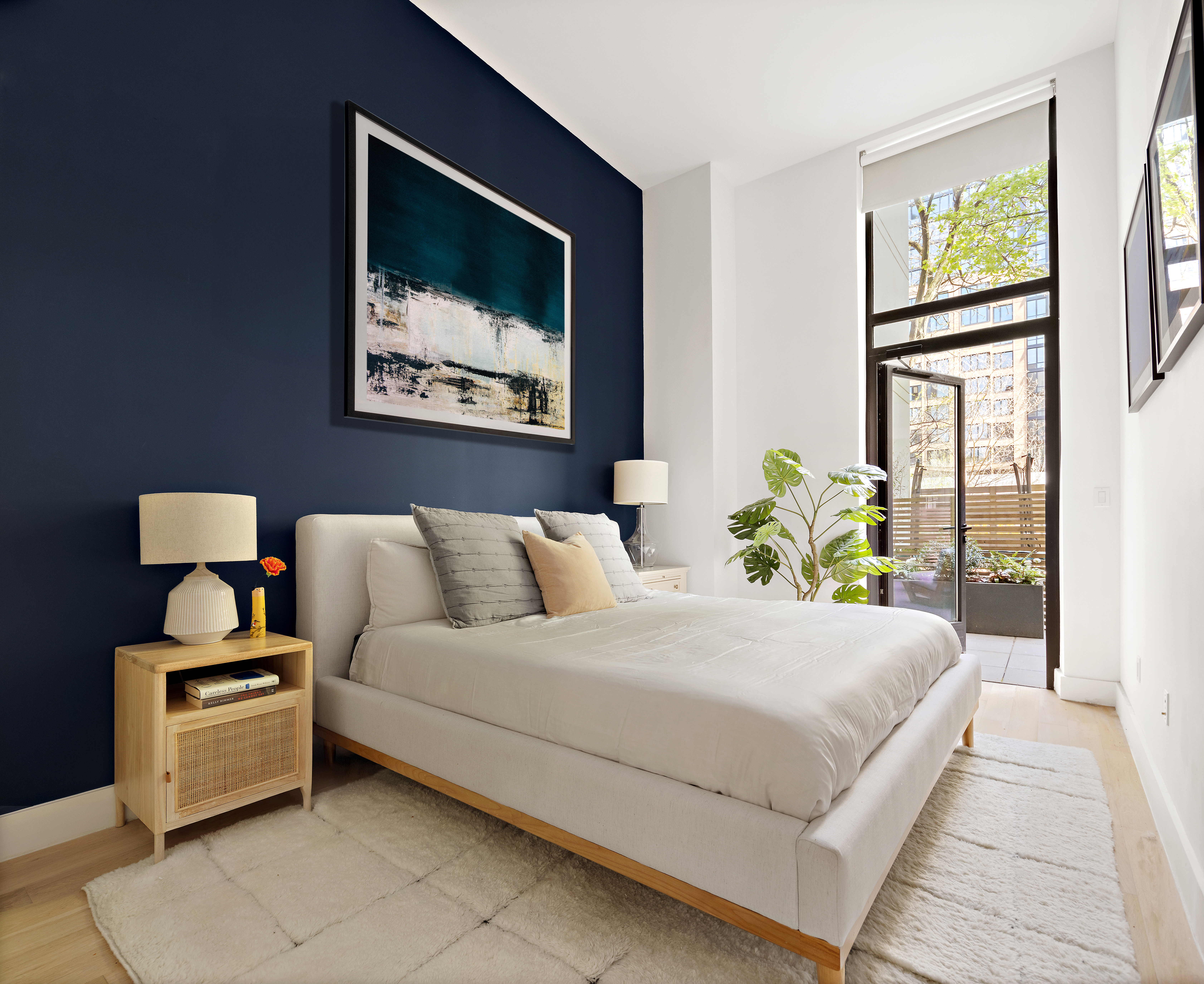 111 Montgomery Street, Unit 1C Brooklyn, NY 11225 - Photo 3 of 15 a bedroom with a bed painting on wall and a large window