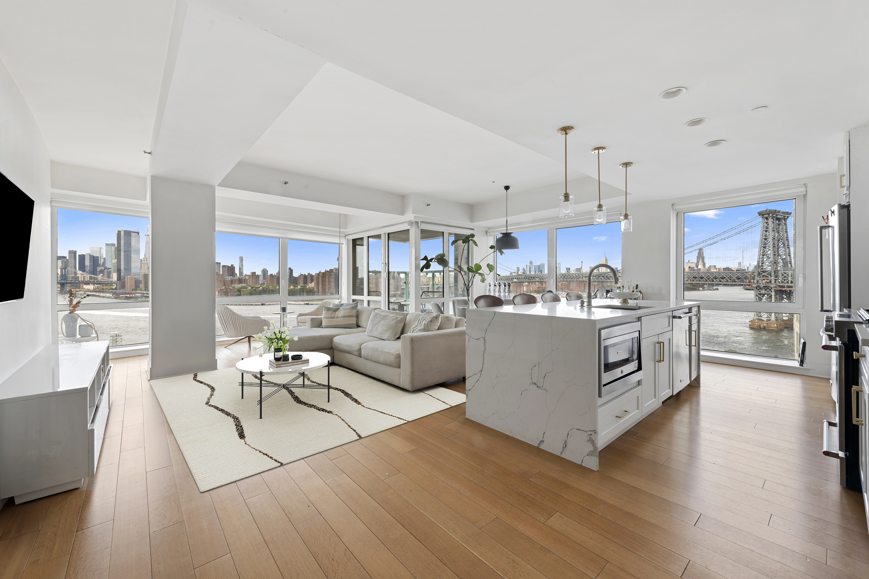 446 Kent Avenue, Unit 14A Brooklyn, NY 11249 - Photo 2 of 19 a living room with kitchen island furniture and a wooden floor