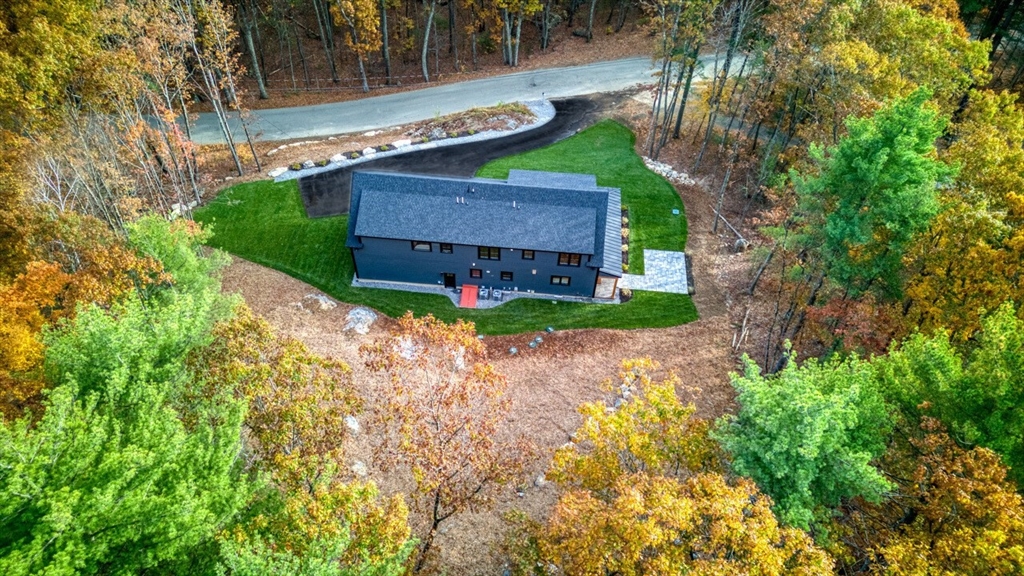 171 Randall Road Berlin, MA 01503 - Photo 40 of 41 a view of a house with a small yard and large tree