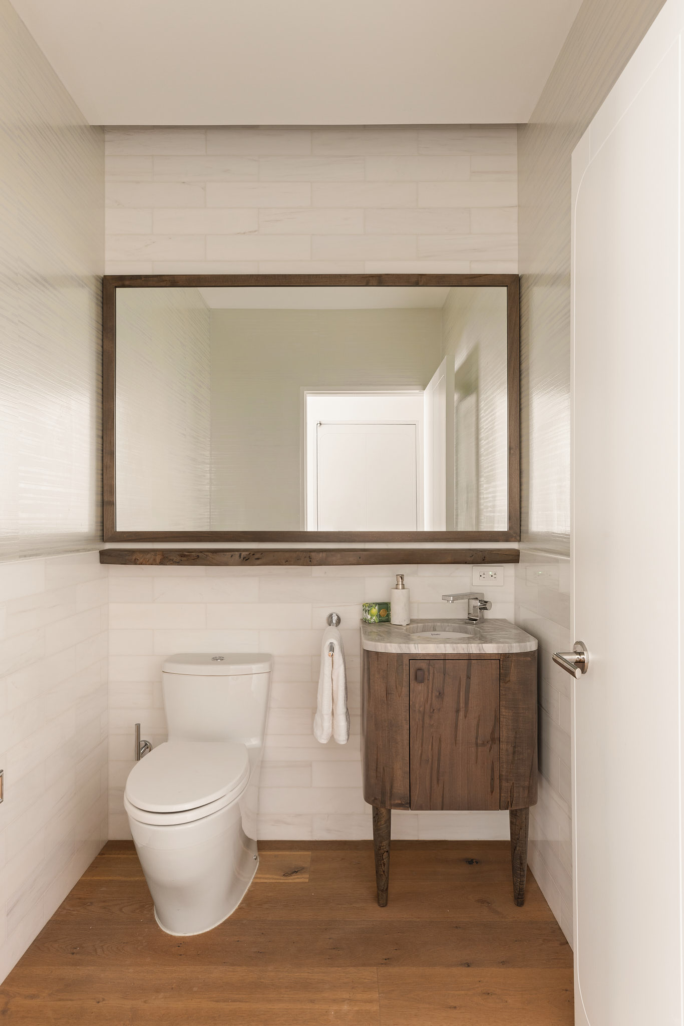 325 West Broadway, Unit 7B Manhattan, NY 10013 - Photo 16 of 21 a bathroom with a toilet a sink and mirror