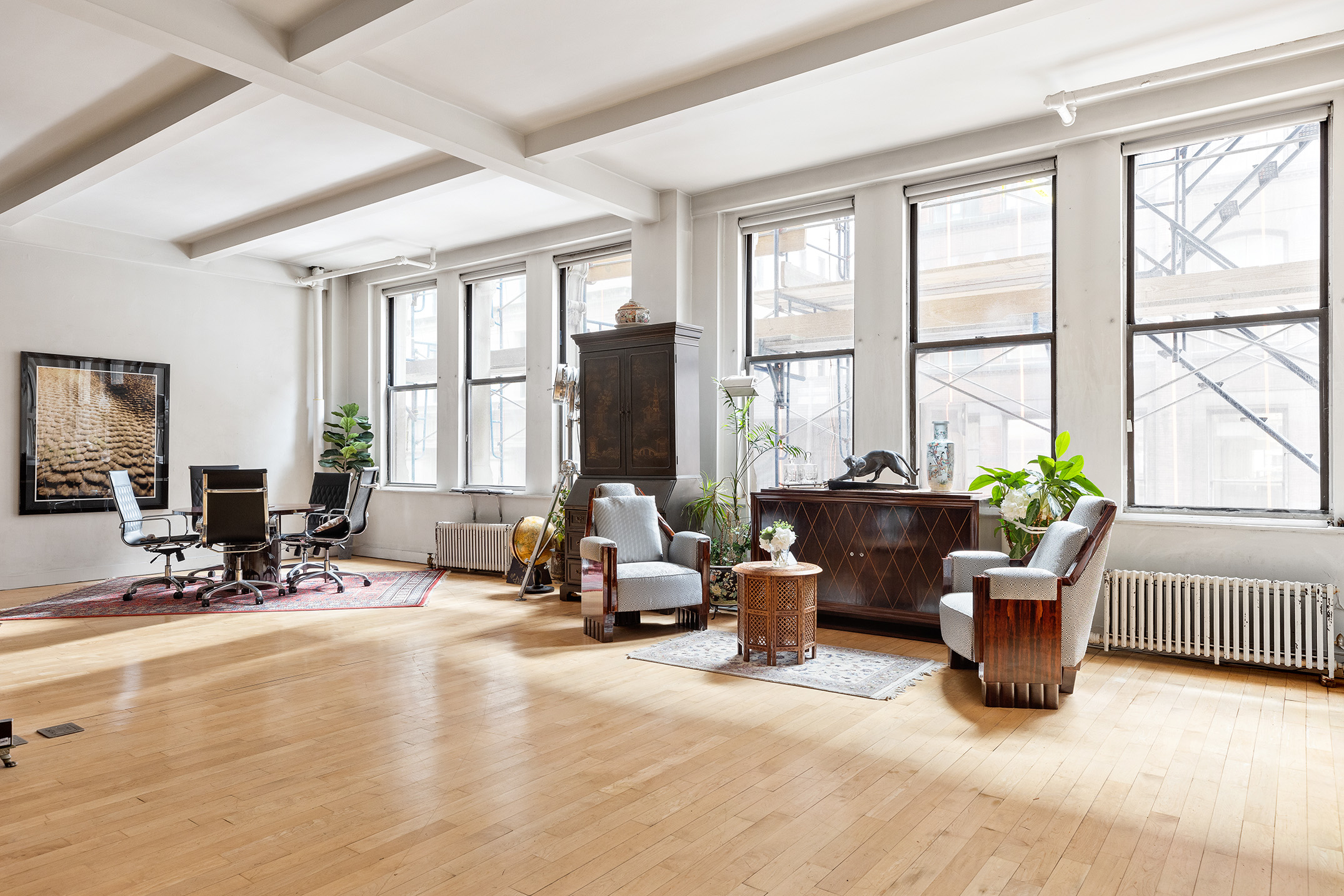 15 West 24th Street Manhattan, NY 10010 - Photo 3 of 14 a living room with furniture and large windows