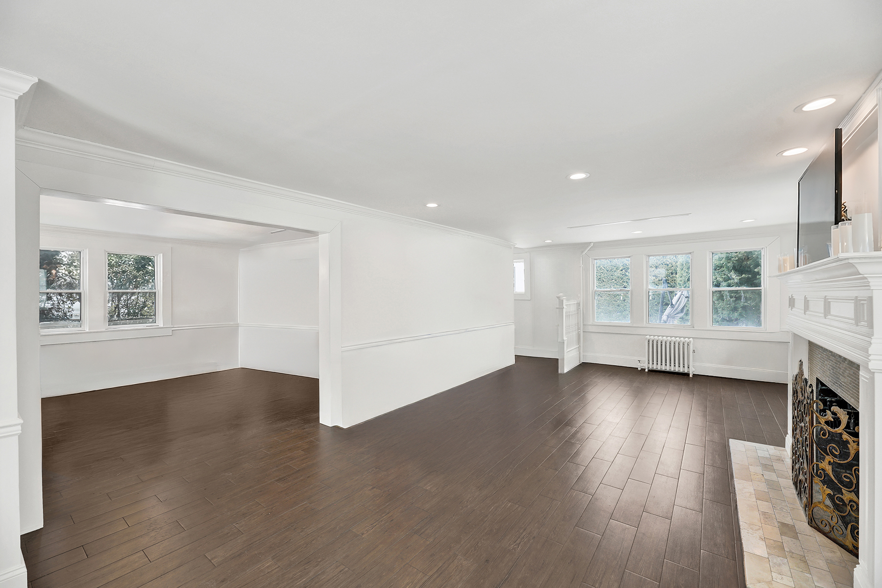 334 Beach 146th Street Queens, NY 11694 - Photo 2 of 21 a view of an empty room with wooden floor and a window