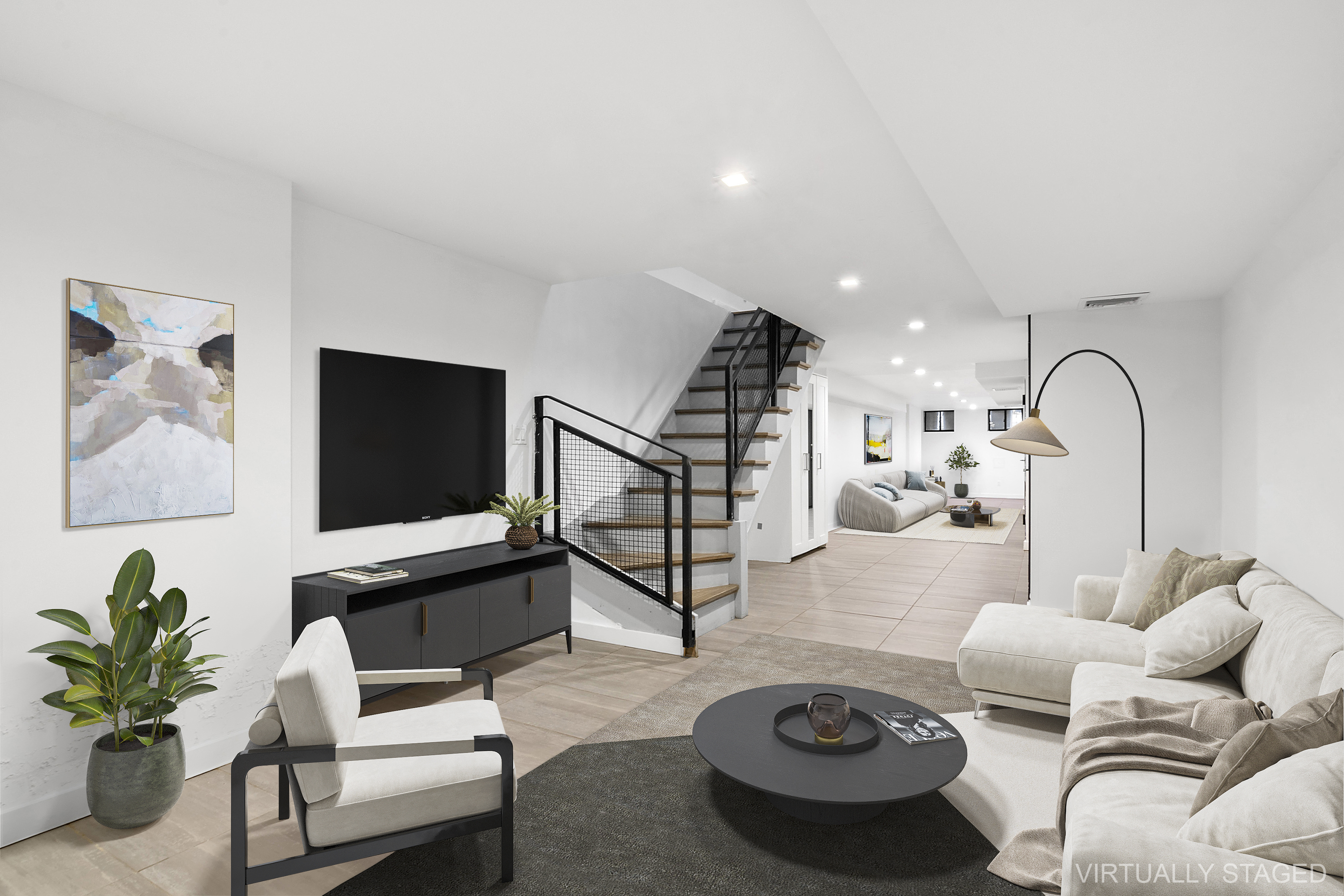 a living room with furniture a rug and a flat screen tv