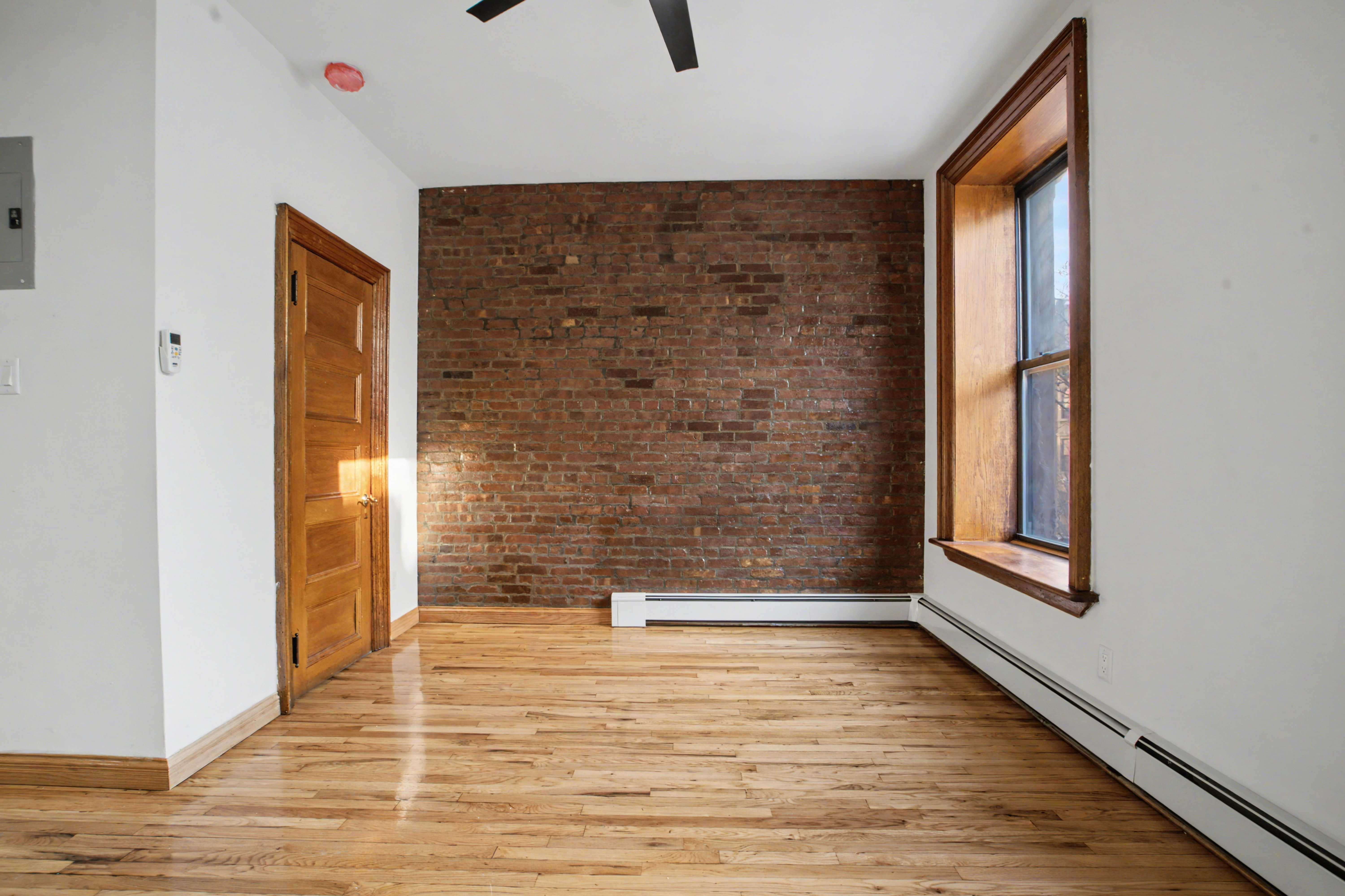 247 West 123rd Street, Unit 2F Manhattan, NY 10027 - Photo 4 of 9 a view of wooden door