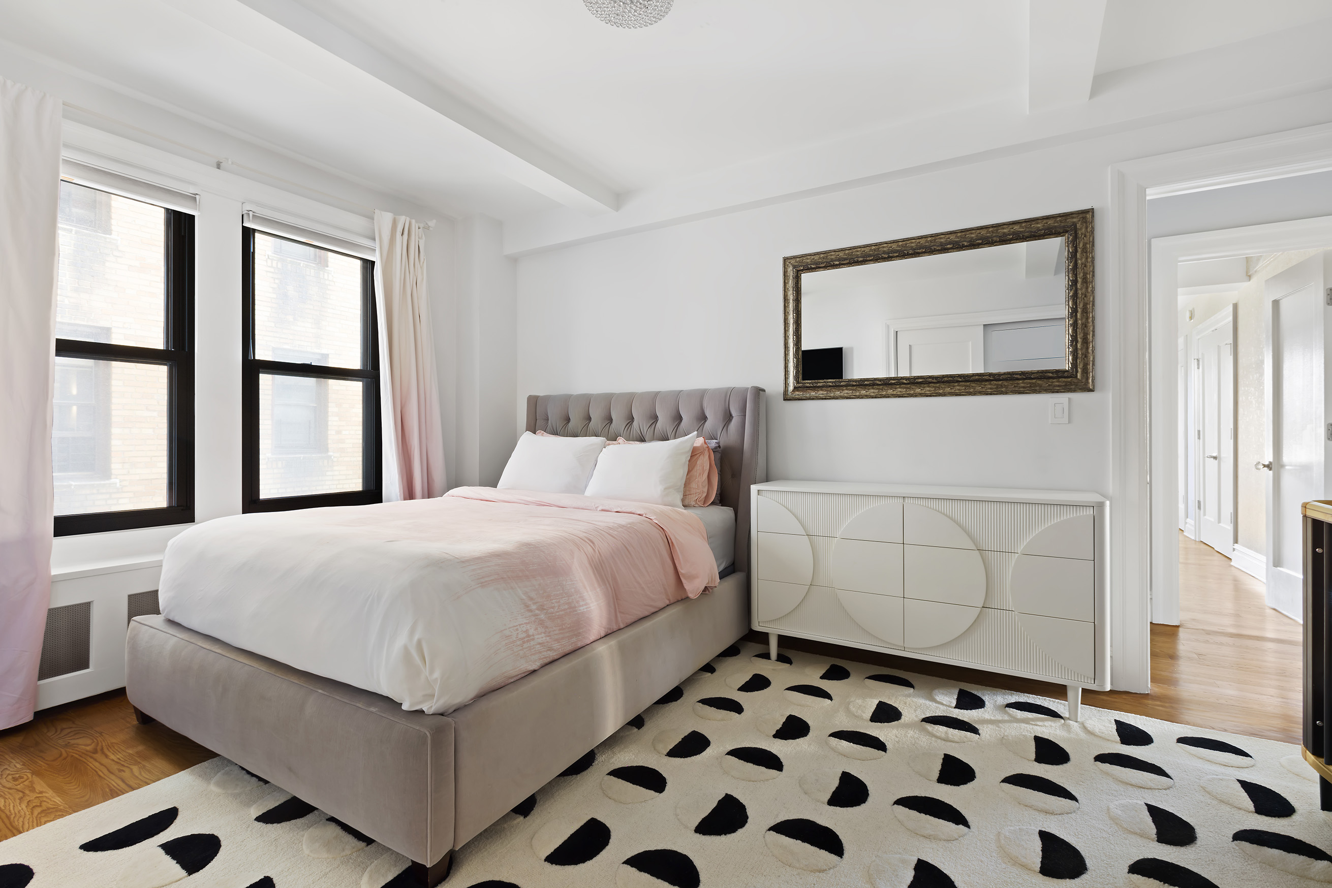 175 West 93rd Street, Unit 10C Manhattan, NY 10025 - Photo 8 of 16 a bedroom with a bed and a window