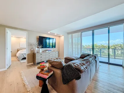 a spacious bedroom with two beds and a large window