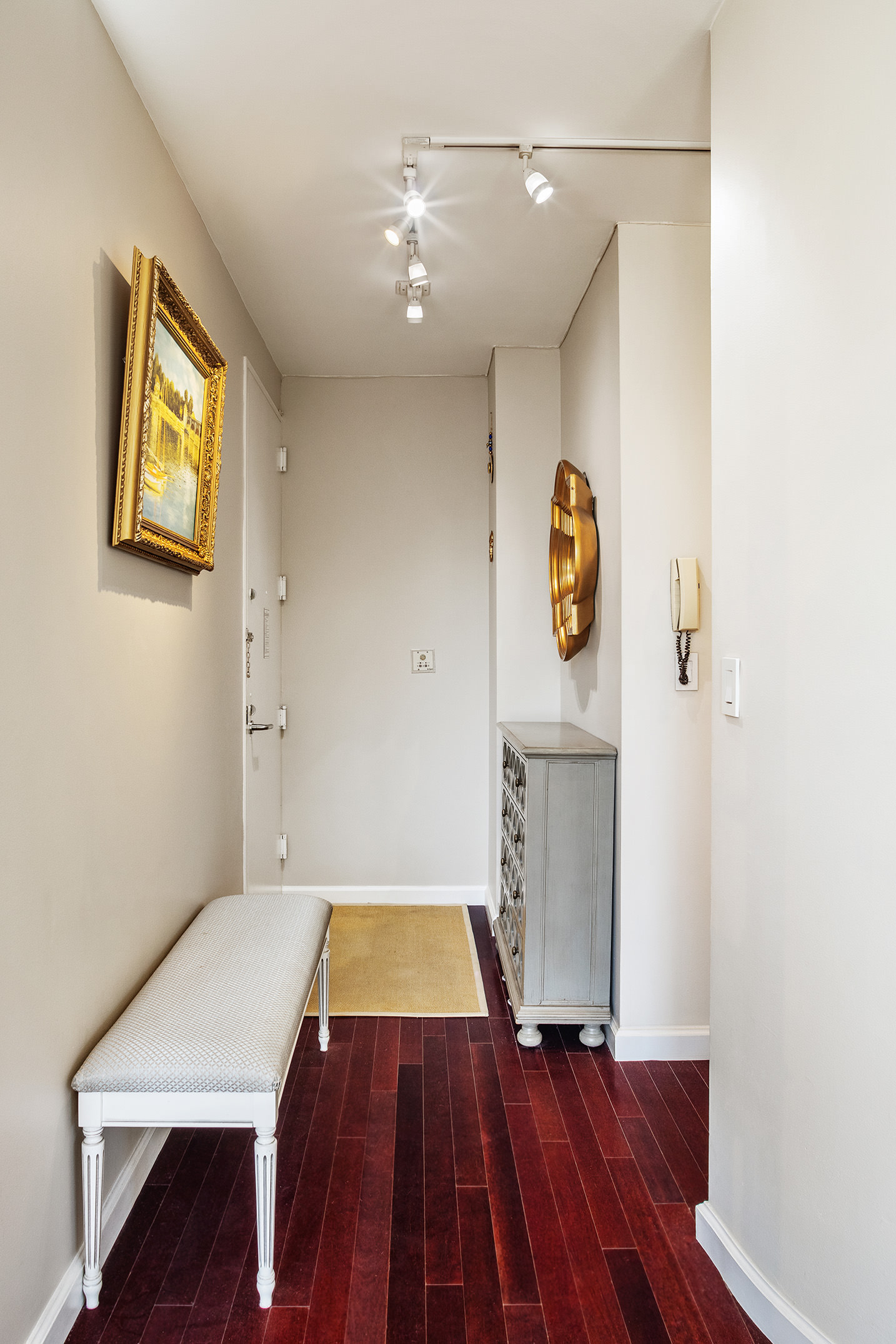 304 East 65th Street, Unit 10D Manhattan, NY 10065 - Photo 8 of 14 a view of an empty room with a window and wooden floor