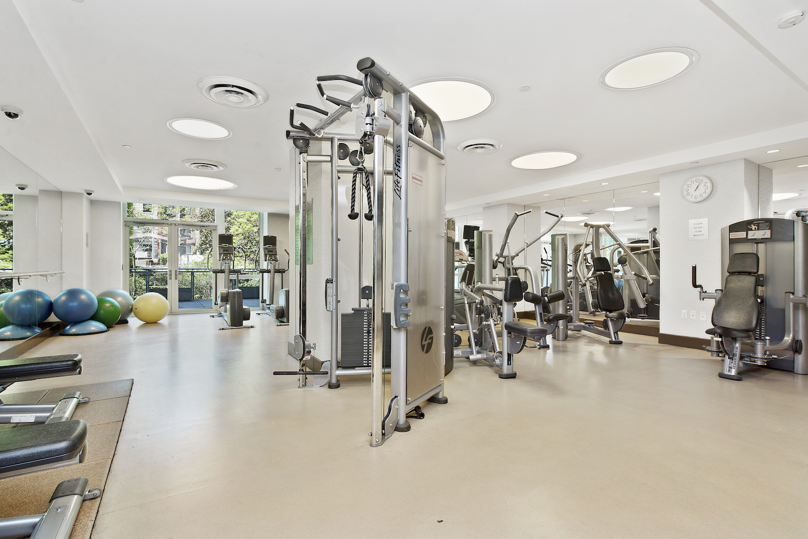 225 East 34th Street, Unit 8B Manhattan, NY 10016 - Photo 11 of 18 a view of a room with gym equipment