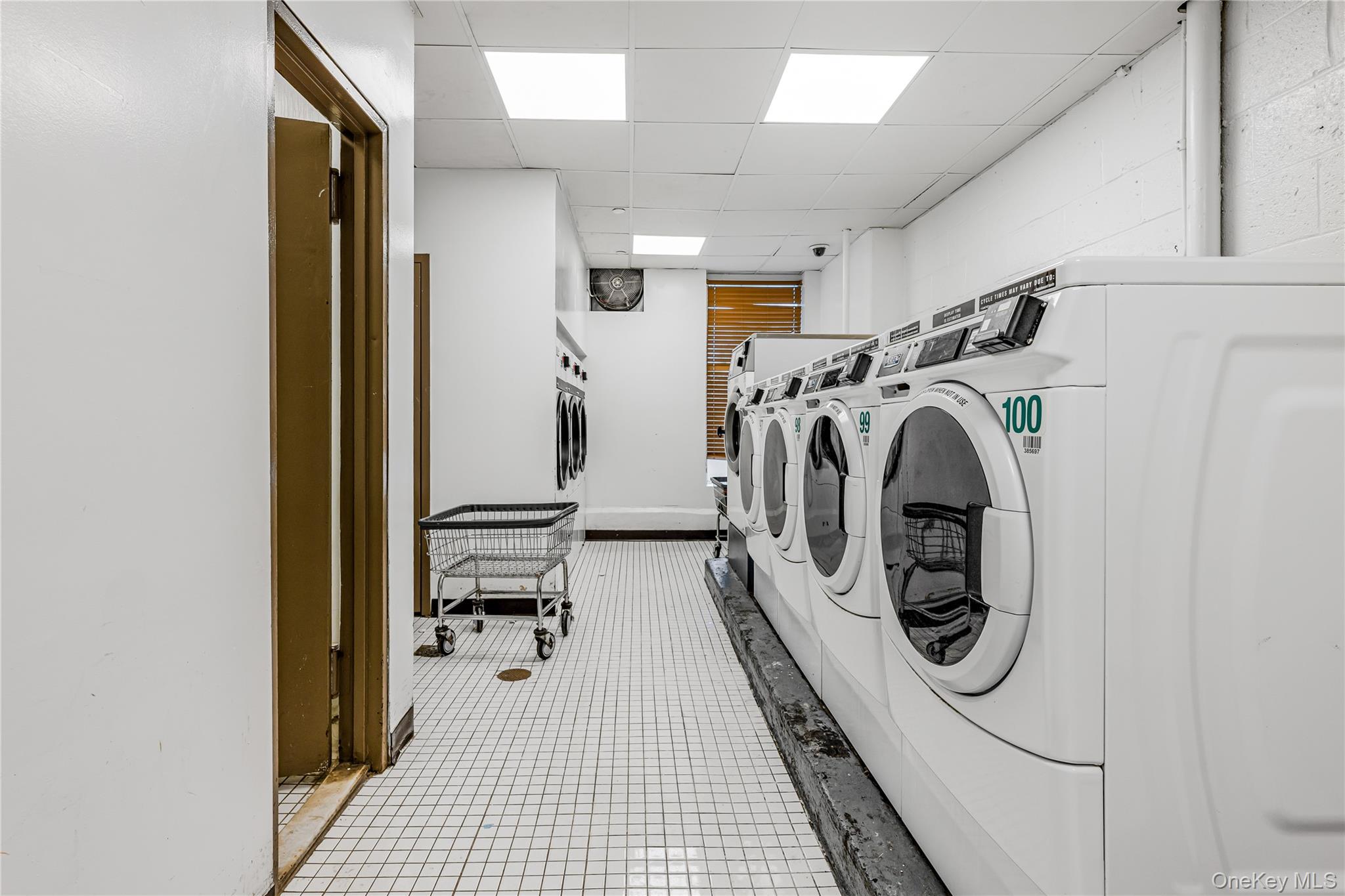 12399 Flatlands Avenue, Unit 1L Brooklyn, NY 11207 - Photo 15 of 21 a view of a storage and utility room with washer and dryer