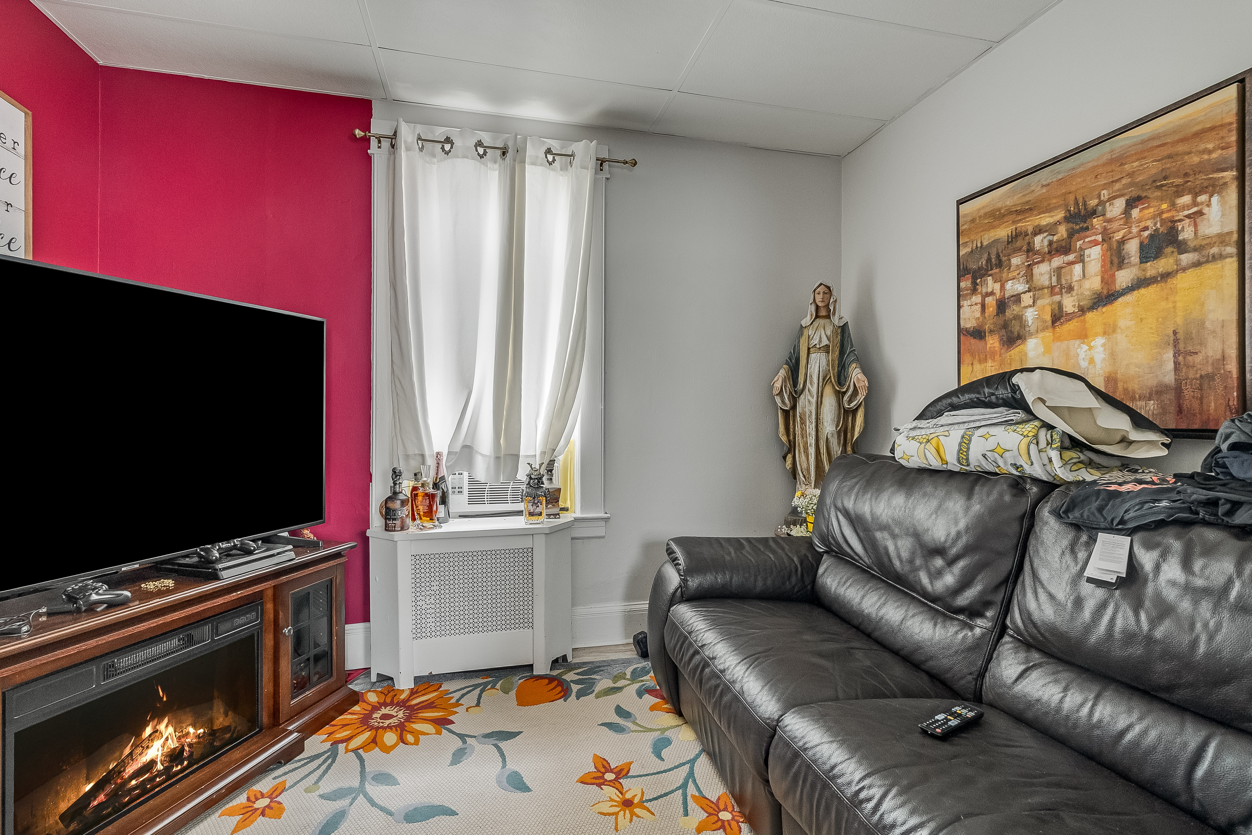 102-104 22nd Avenue Paterson, NJ 07513 - Photo 12 of 37 a living room with furniture and a flat screen tv