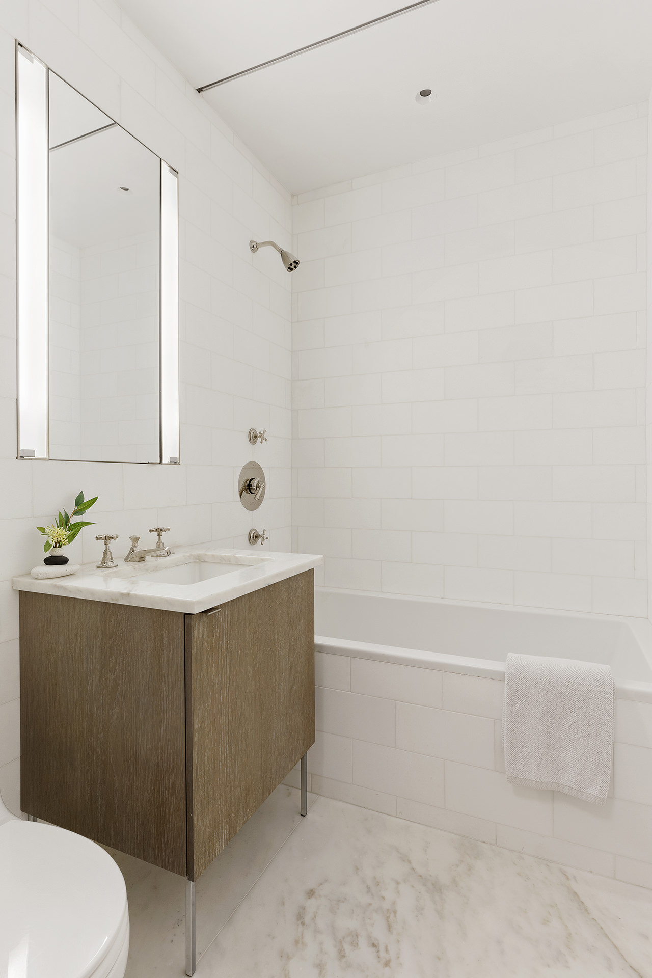7 Harrison Street, Unit ATELIER Manhattan, NY 10013 - Photo 15 of 24 a bathroom with a sink and mirror