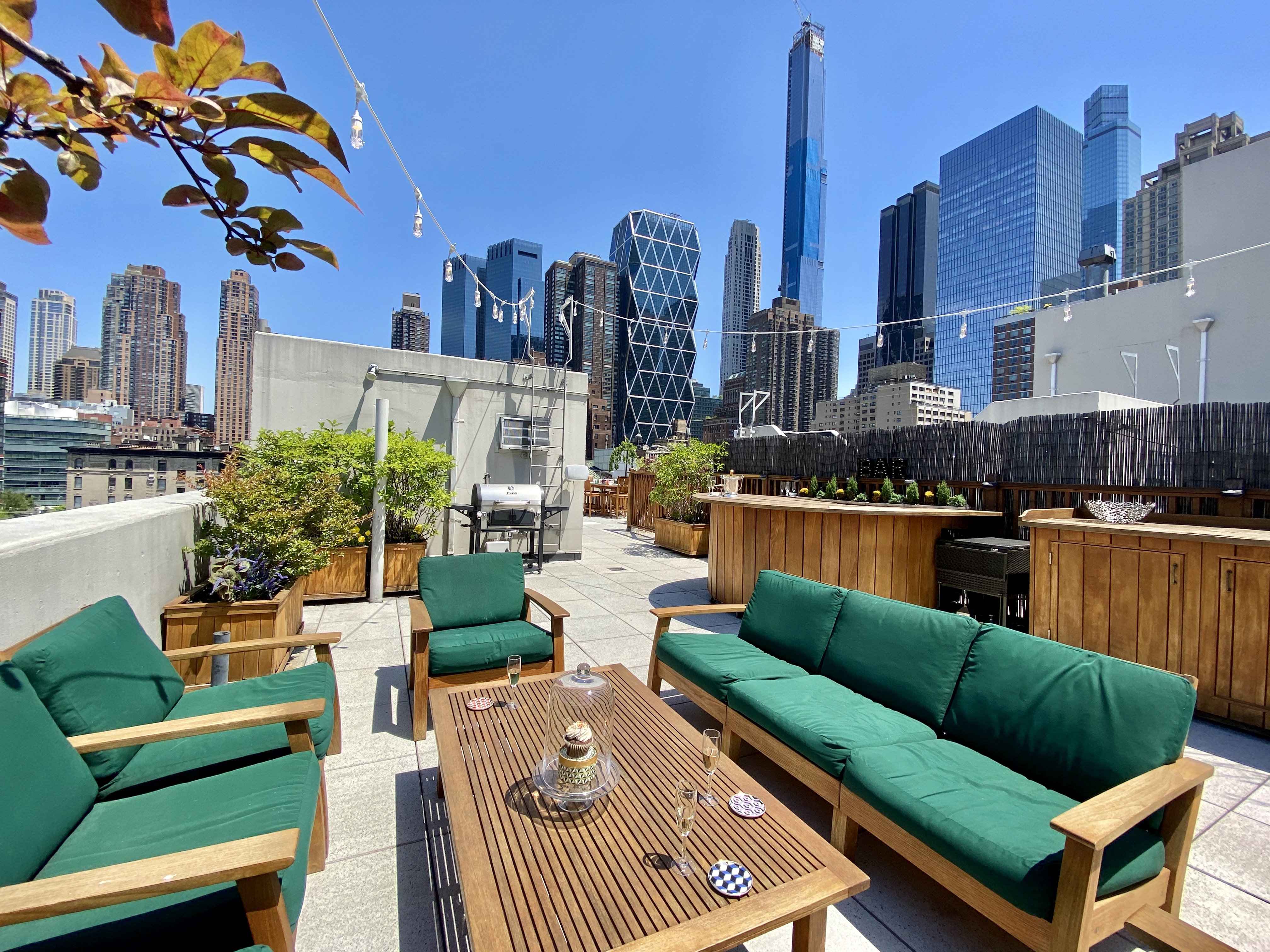 350 West 53rd Street, Unit PHB Manhattan, NY 10019 - Photo 24 of 34 a view of a terrace with couches and potted plants