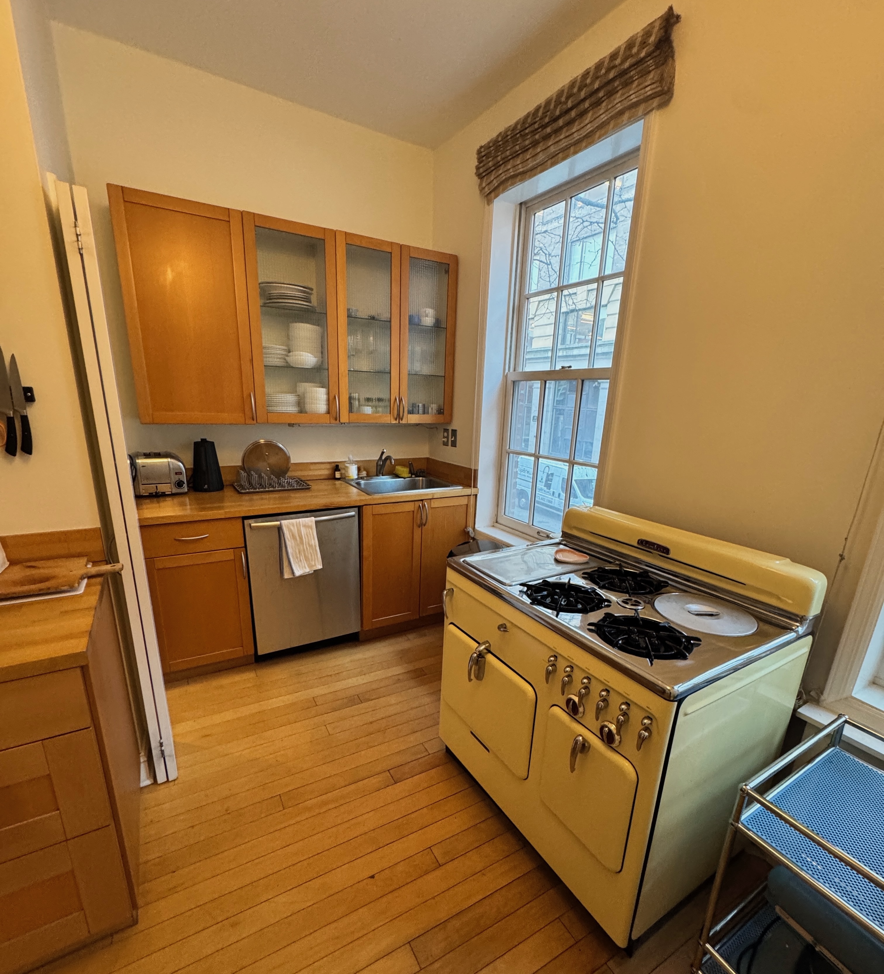 19 Vandam Street, Unit 2 Manhattan, NY 10014 - Photo 16 of 19 a kitchen with stainless steel appliances granite countertop a stove a sink and a refrigerator