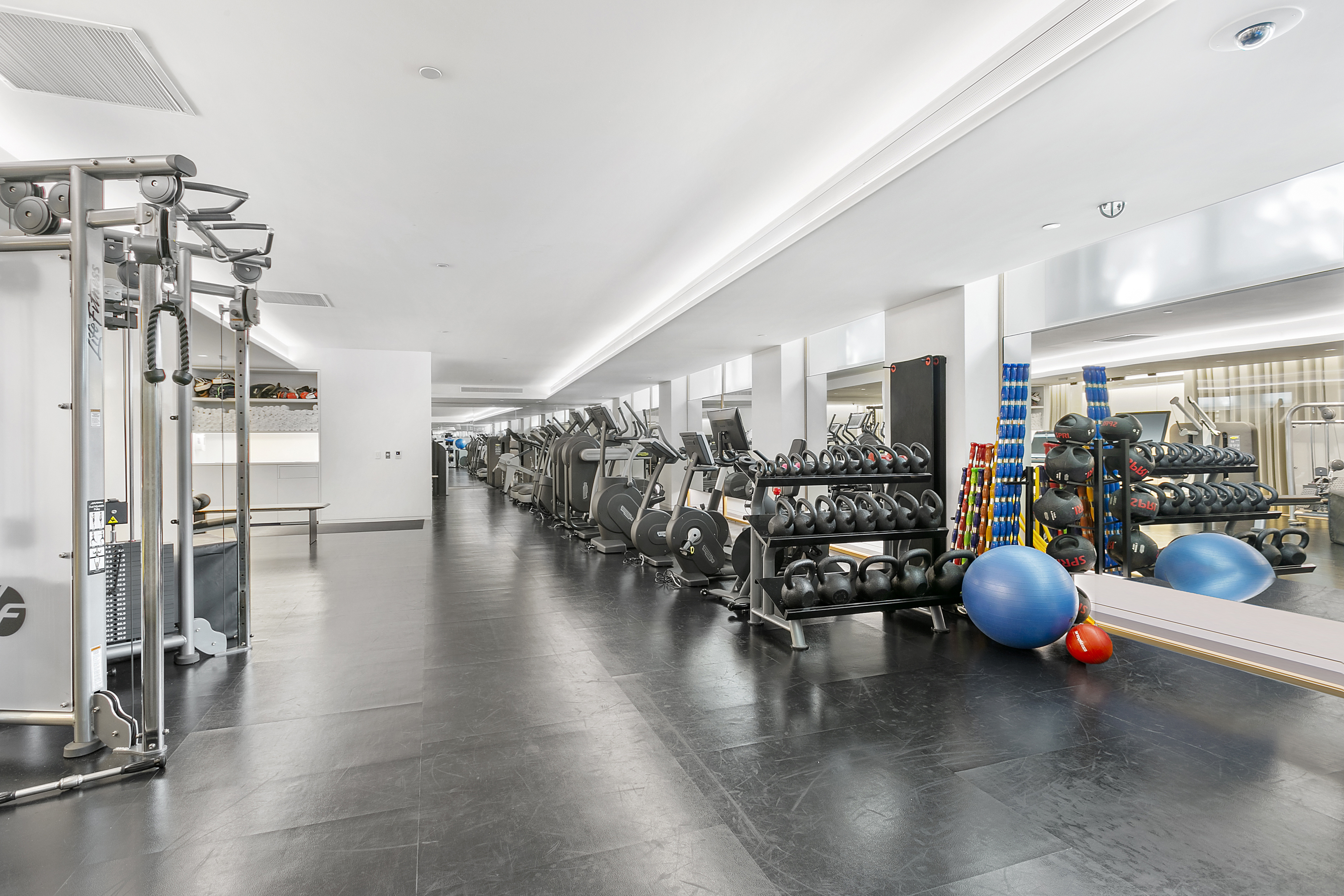 400 West 12th Street, Unit 3F Manhattan, NY 10014 - Photo 10 of 15 a hallway with wooden floor and furniture