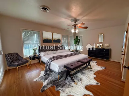 a bedroom with a bed window and a couch