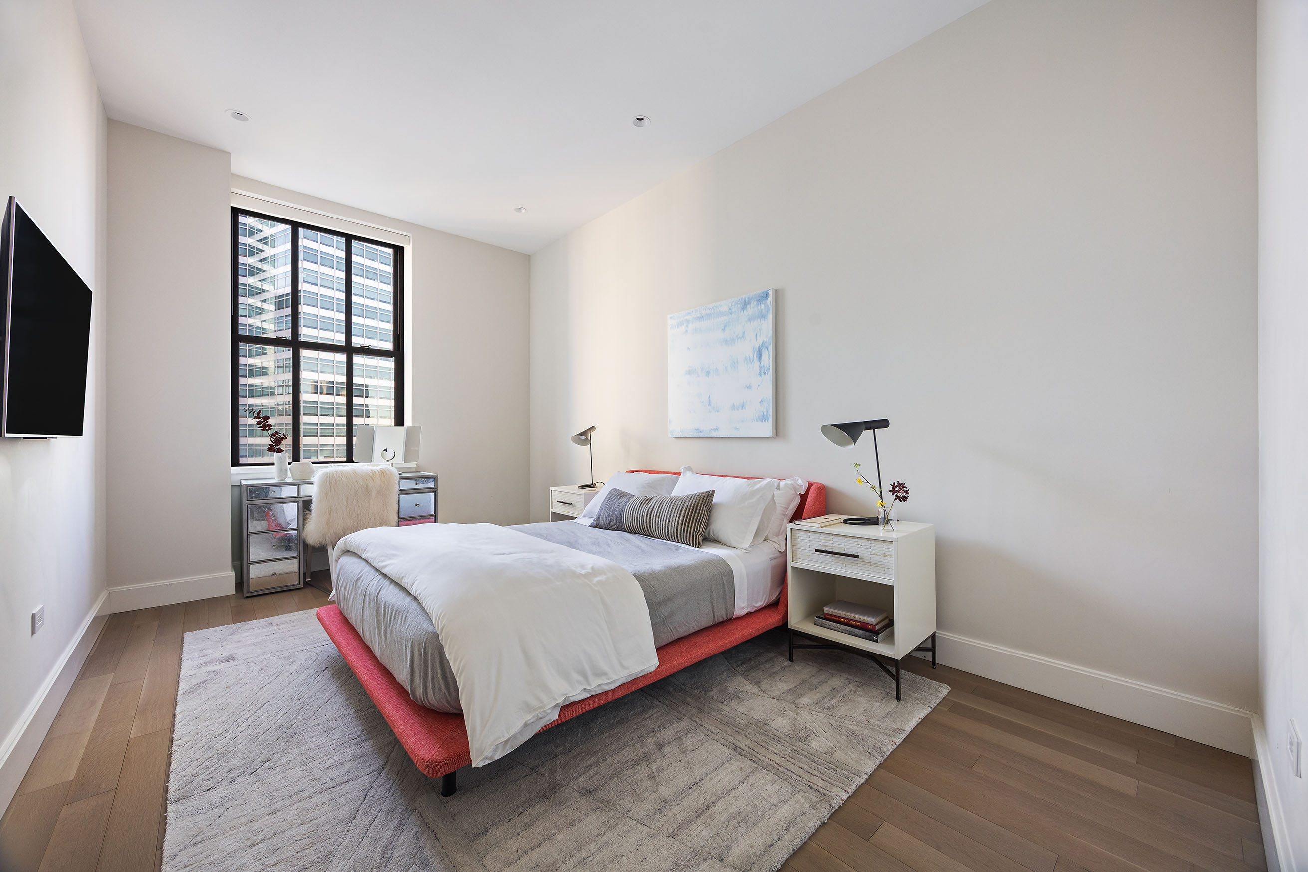 100 Barclay Street, Unit 21AD Manhattan, NY 10007 - Photo 18 of 37 a bedroom with a bed and a window