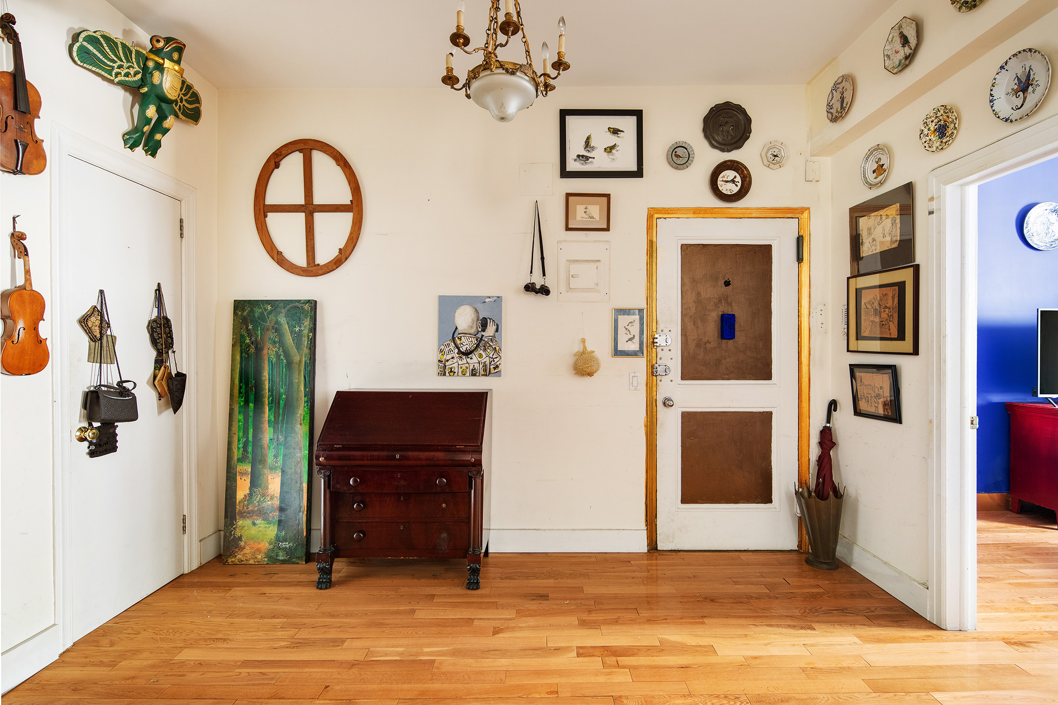 57 West 58th Street, Unit 8A Manhattan, NY 10019 - Photo 4 of 8 a view of a livingroom with furniture and hallway